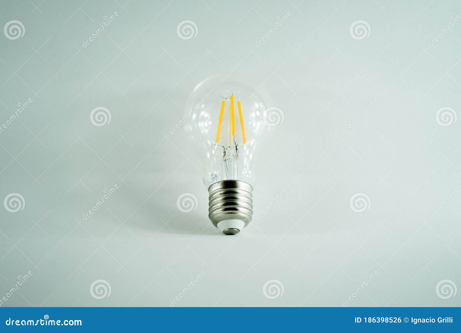 conceptual light bulb in minimalist white background