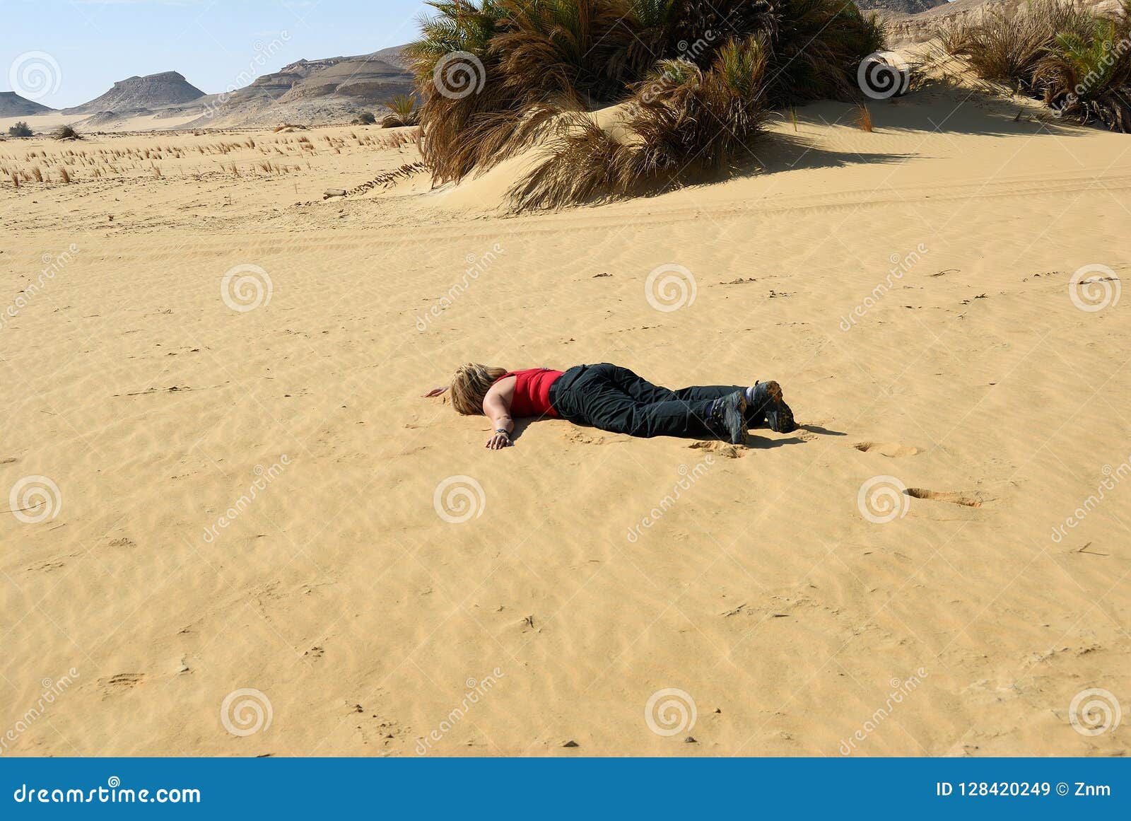 Human body in the desert stock image. Image of lying 128420249