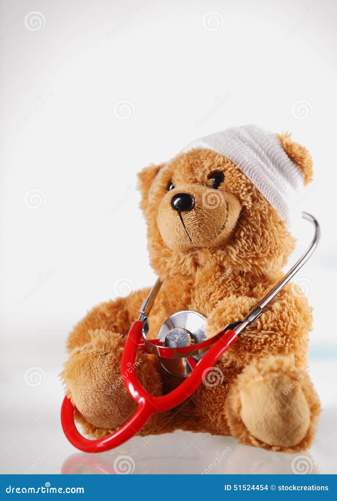 conceptual sick teddy bear with stethoscope device