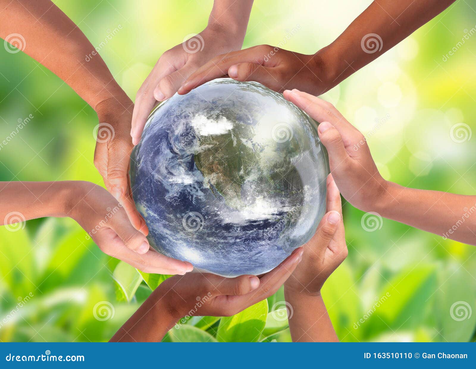 conceptual  of multiracial human hands surrounding the earth globe. unity, world peace, humanity concept