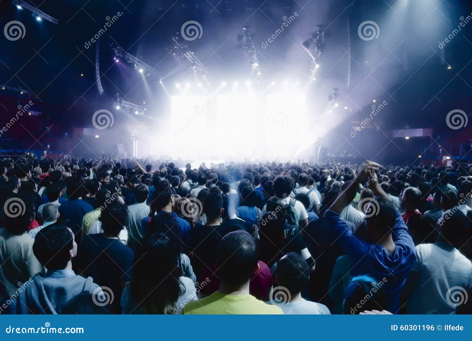 Concert Crowd of People in Front of Bright Stage Lights Editorial Photo