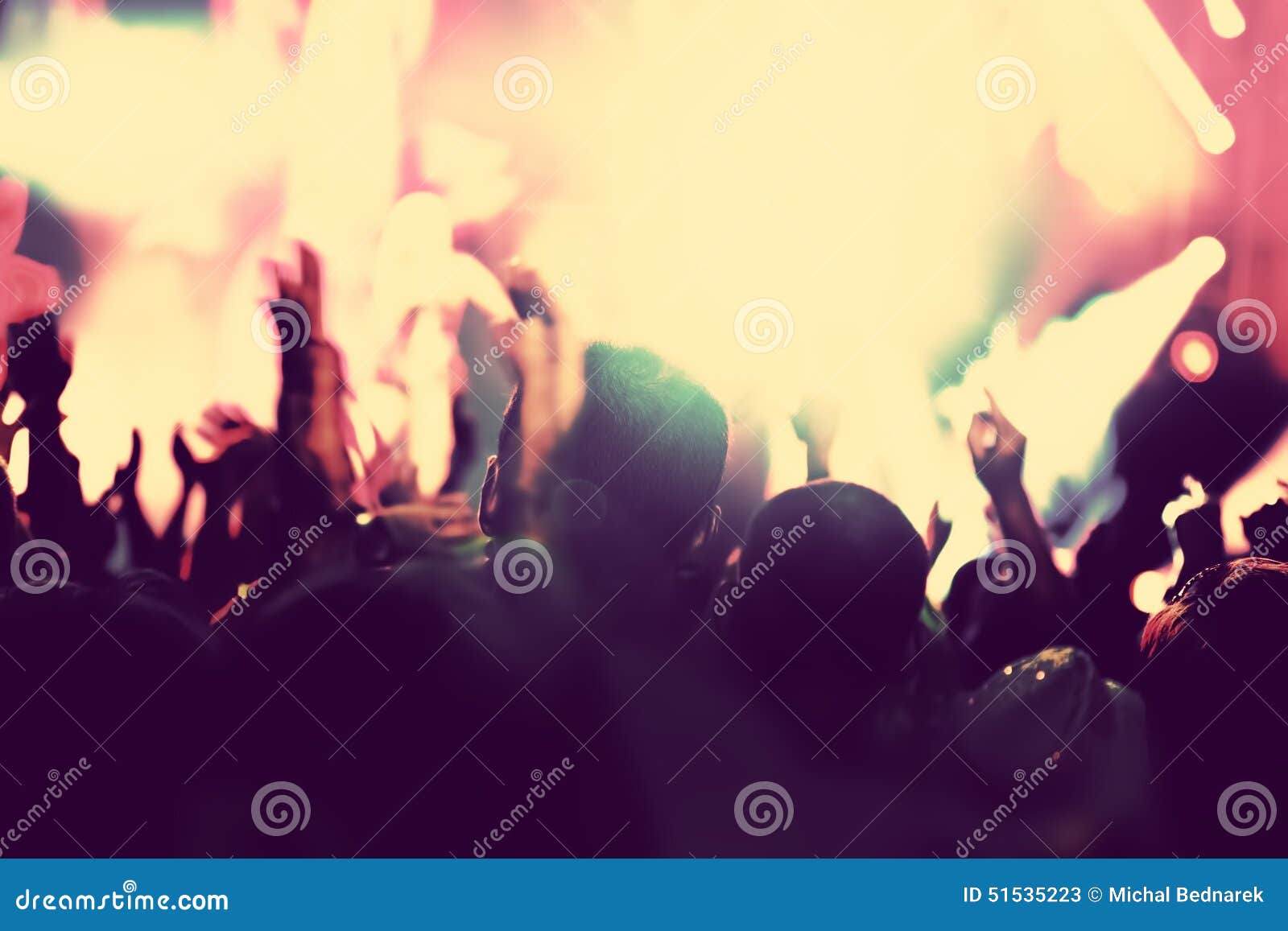 concert, disco party. people with hands up in night club.