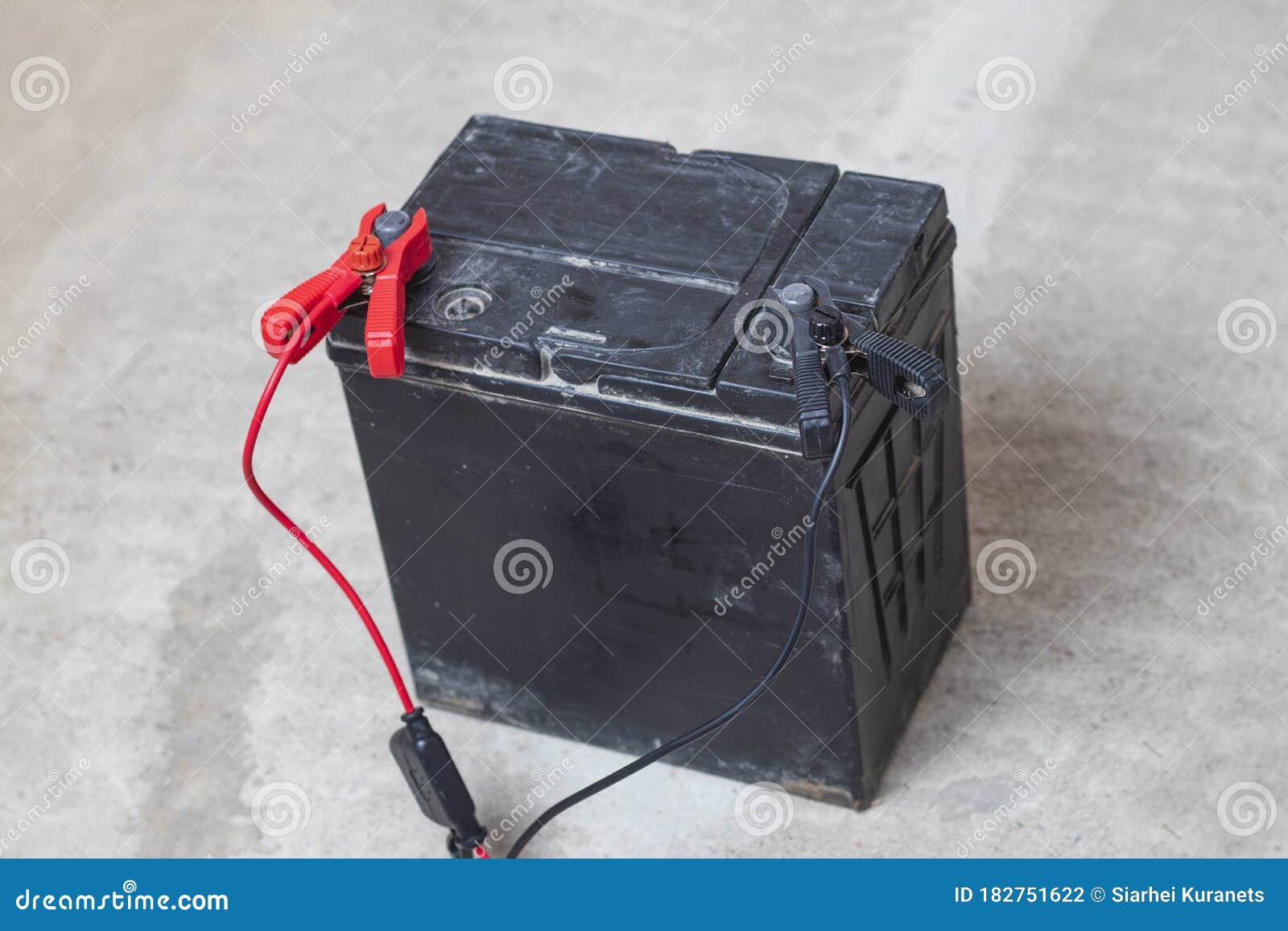 sektor spor fløjte On the Concrete Floor a Flock of Car Battery, the Master Puts Clips on the  Terminals for Recharging Stock Photo - Image of analyzing, care: 182751622