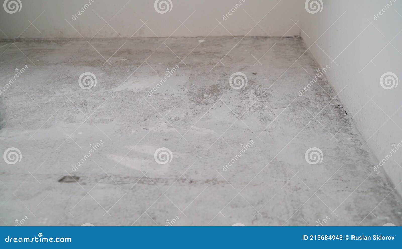 concrete floor in a new apartment. concrete floor before processing. unfinished building interior, detail of a white