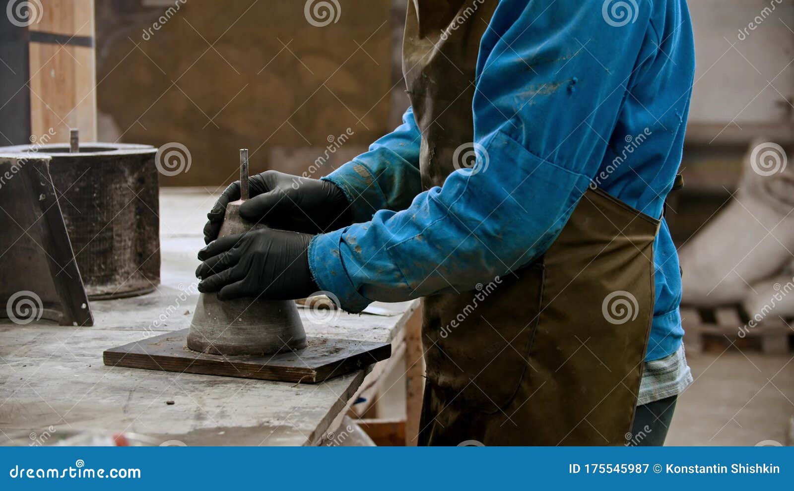 Concrete Industry Worker Preparing the Form for Working with Concrete