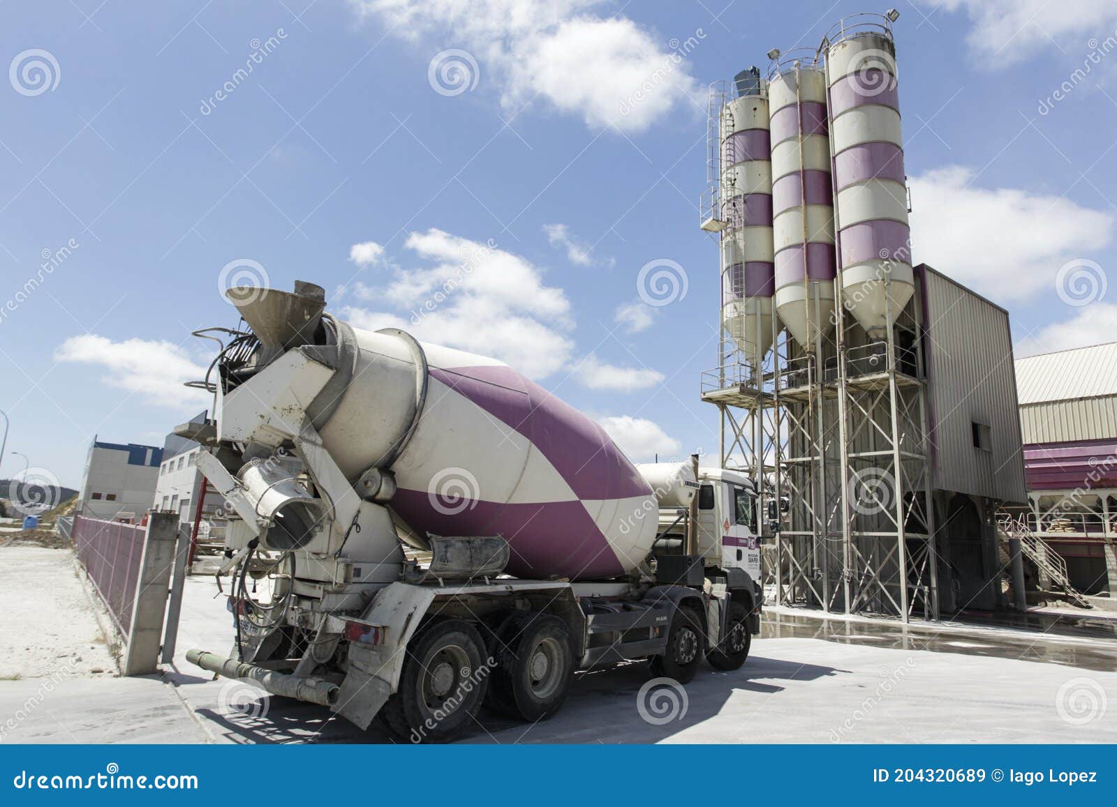 Concrete Mixer Loading in Silos with Cement Inside on Editorial Stock