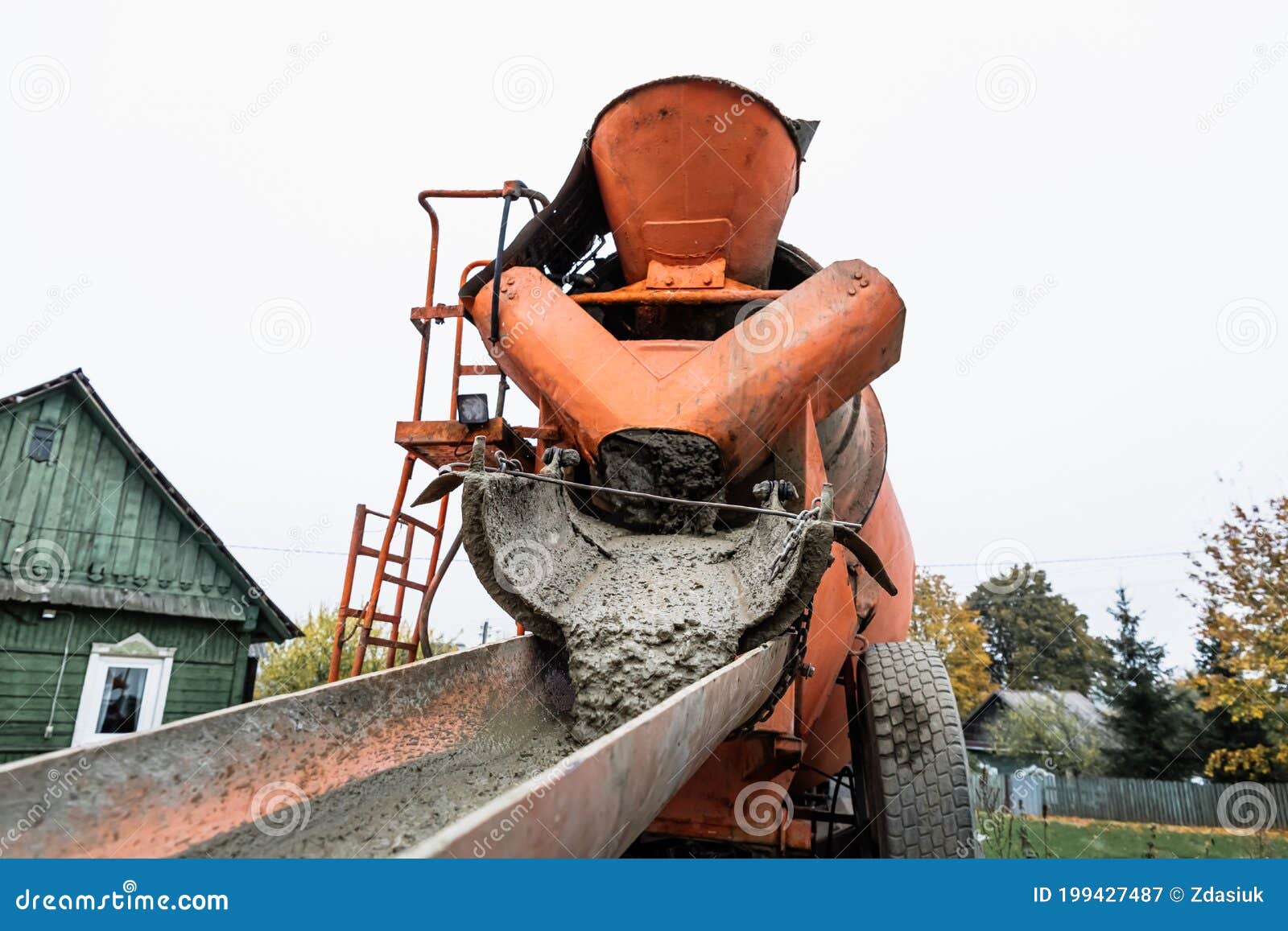 The Concrete Mixer Unloads the Concrete through a Chute into a Prepared