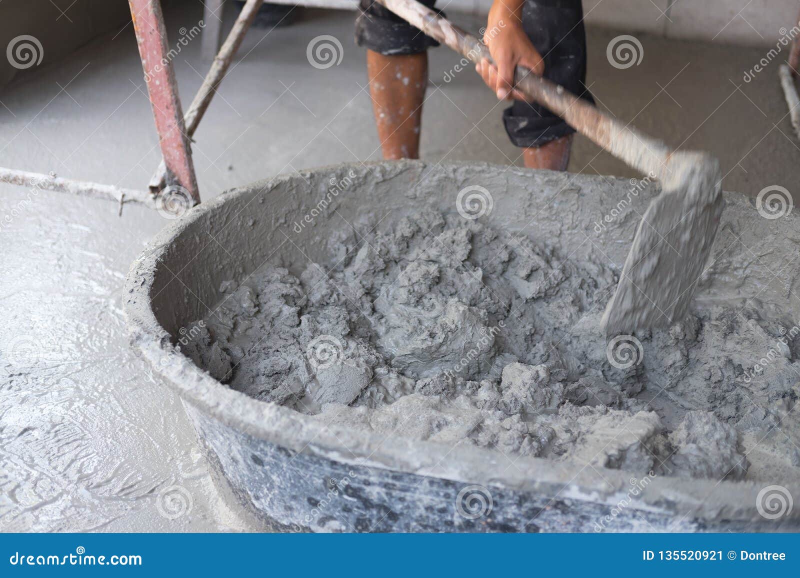 Concrete Mixing Step of Sand Cement and Water by Construction Workers