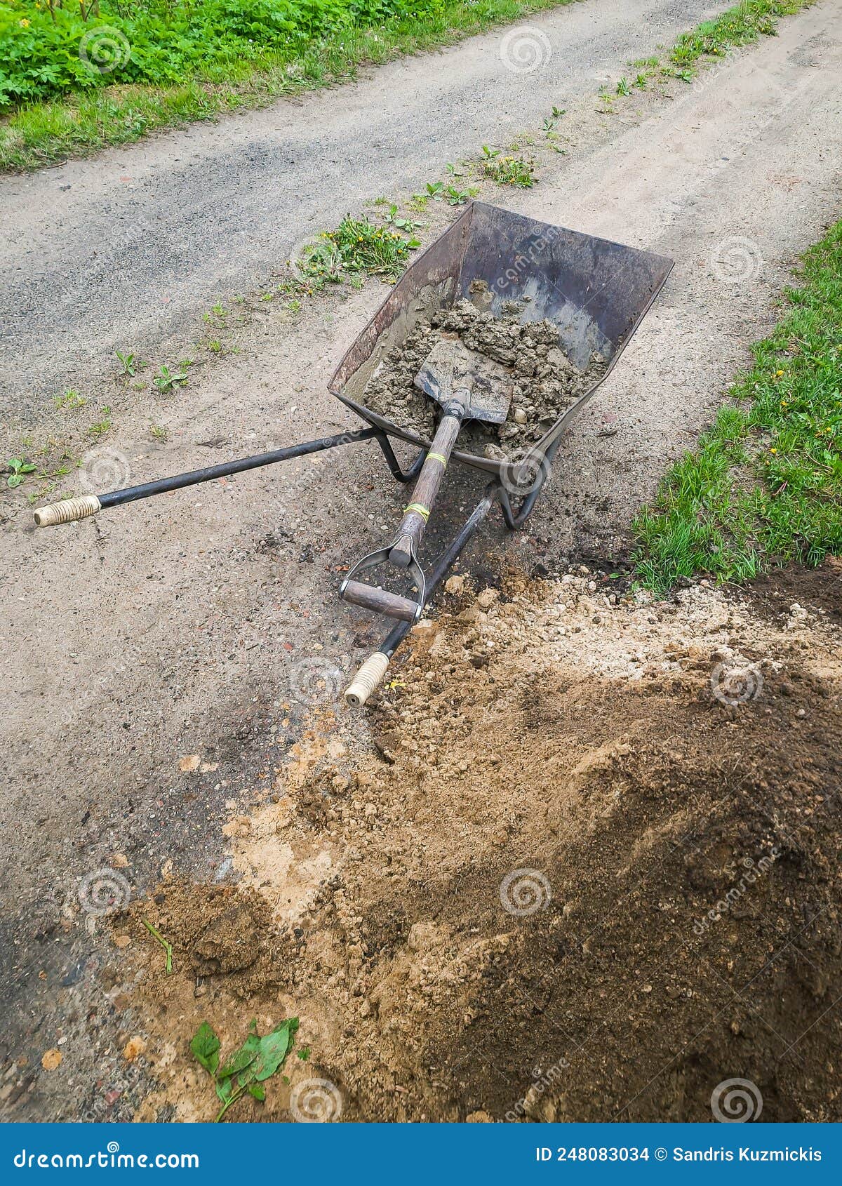 Concrete Mortar and Shovel Prepared in a Wheelbarrow for Construction