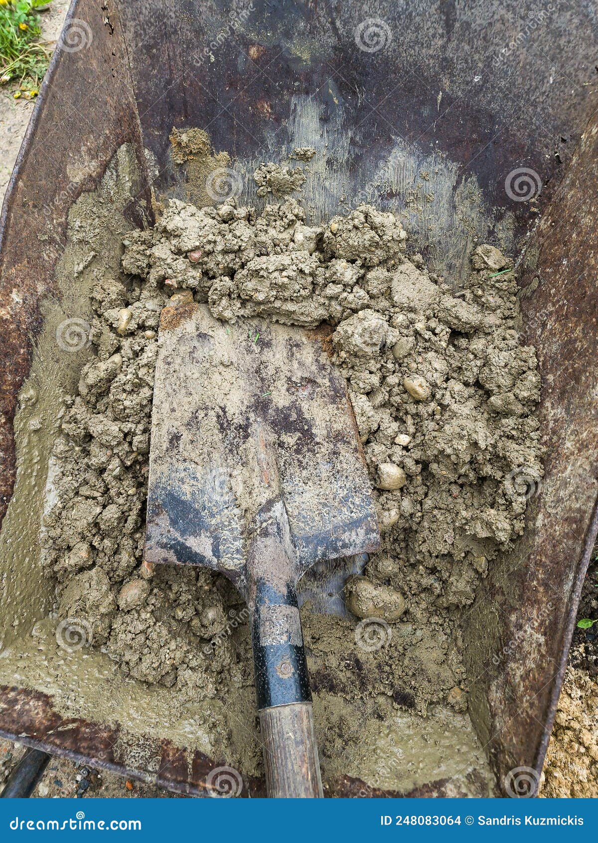 Concrete Mortar and Shovel Prepared in a Wheelbarrow for Construction