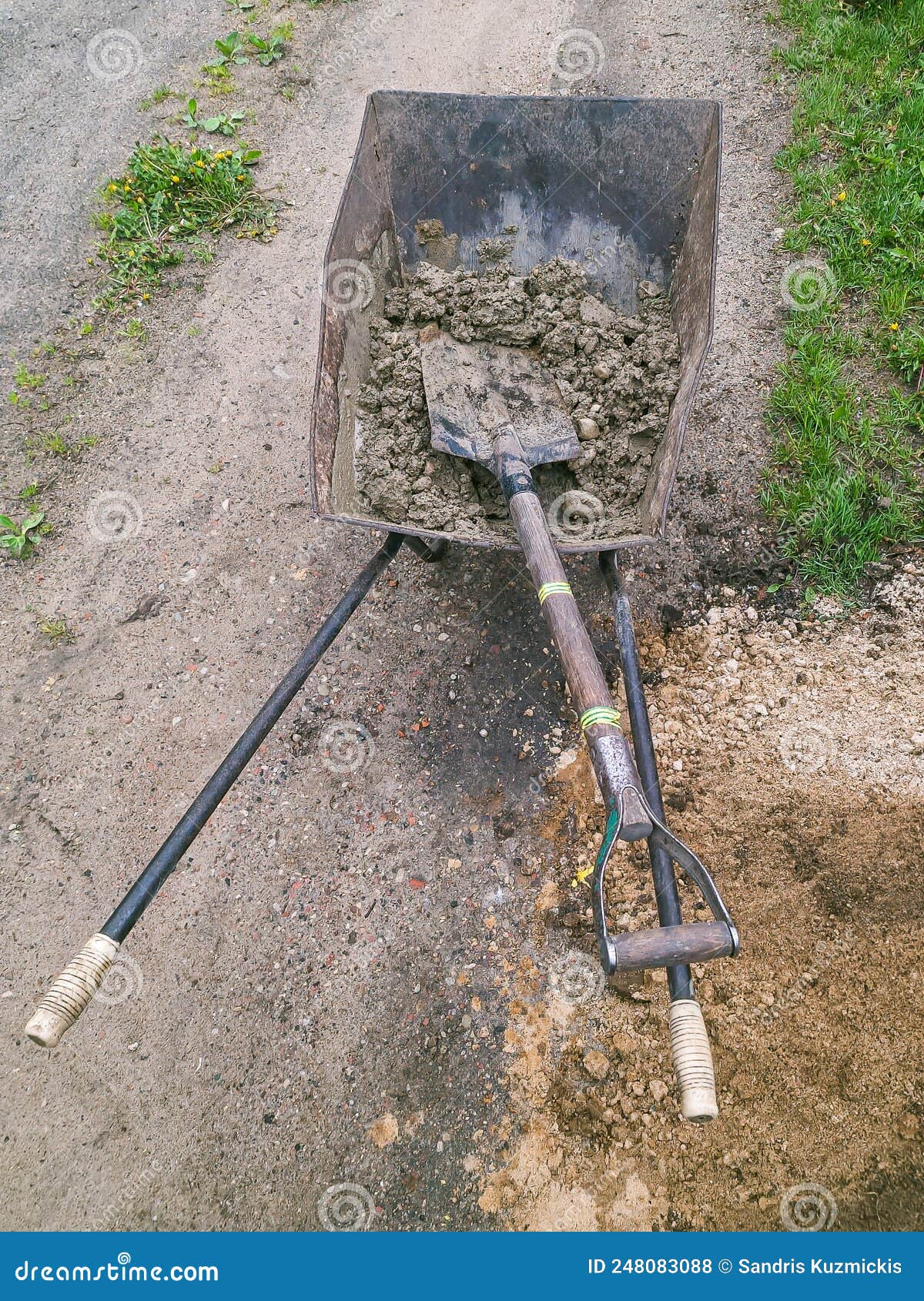 Concrete Mortar and Shovel Prepared in a Wheelbarrow for Construction