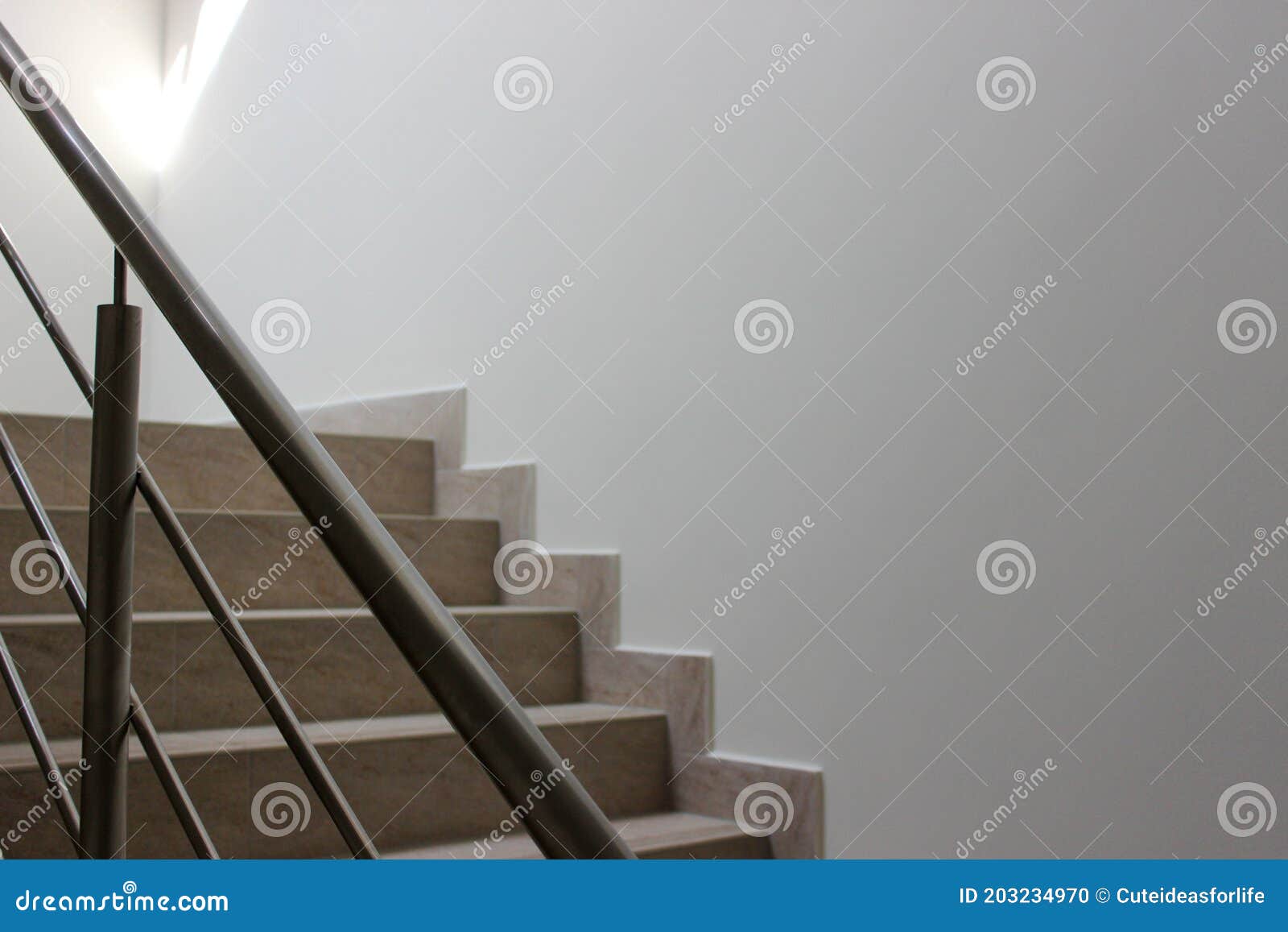 Concrete Stairs with Metal Handrails Inside the House Stock Photo