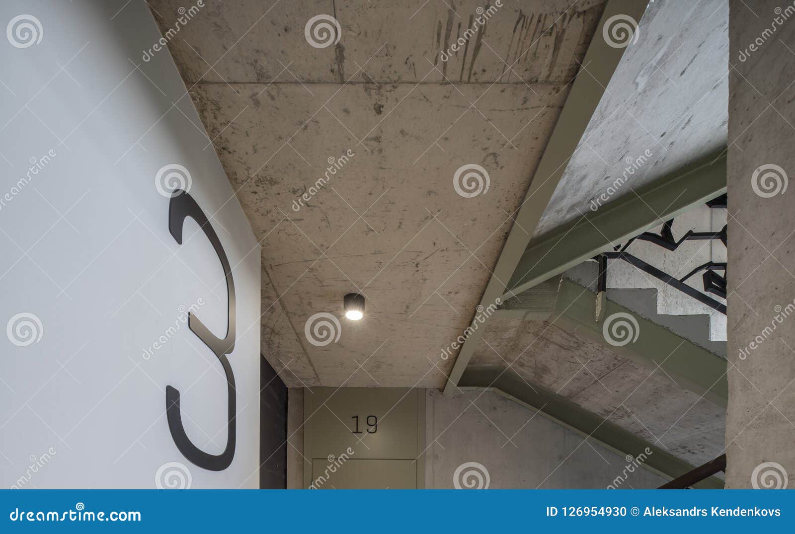 Concrete Ceiling and Lighting in a Modern Apartment. Concrete Style in the Apartment. Stock