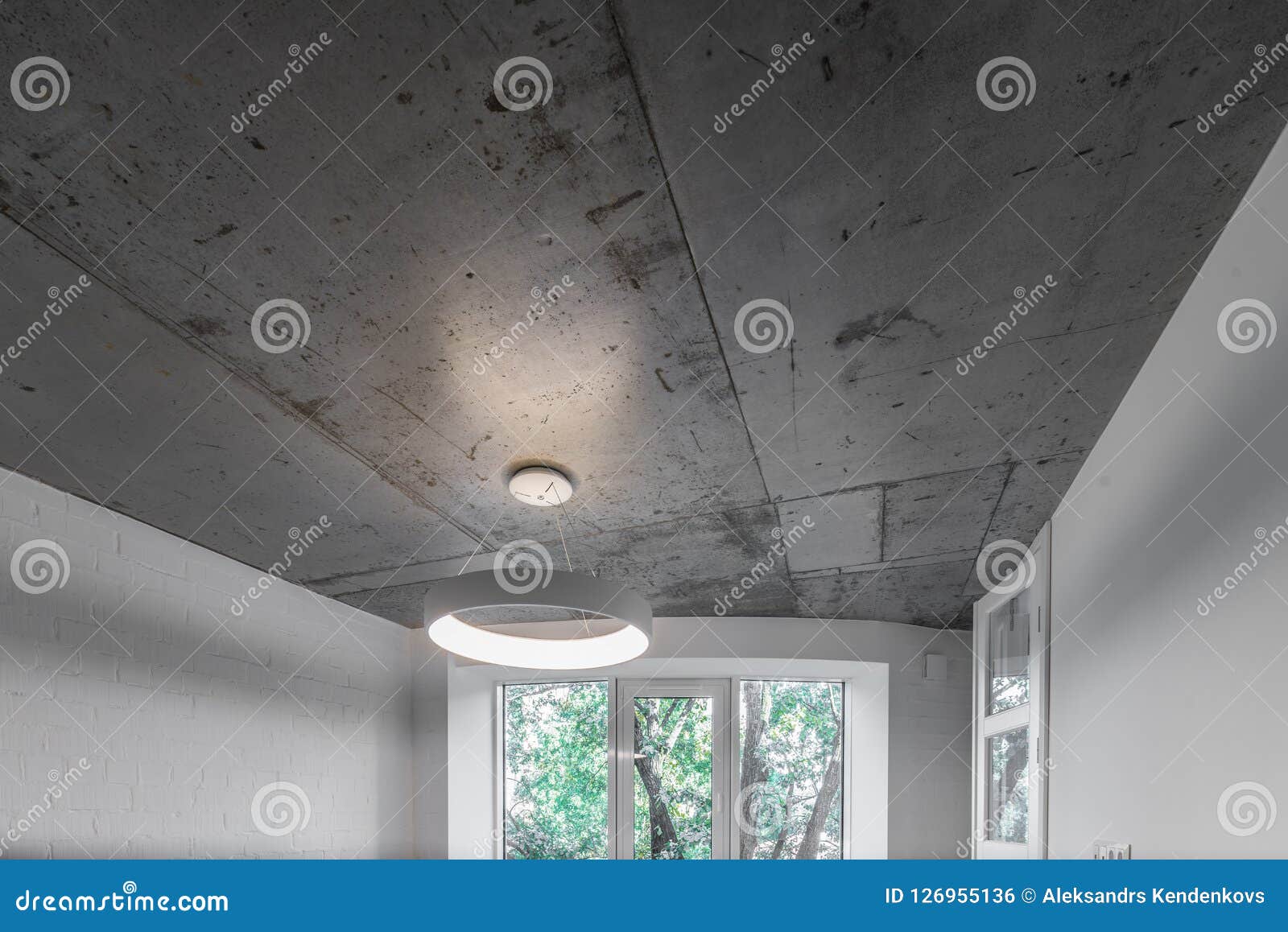 Concrete Ceiling And Lighting In A Modern Apartment