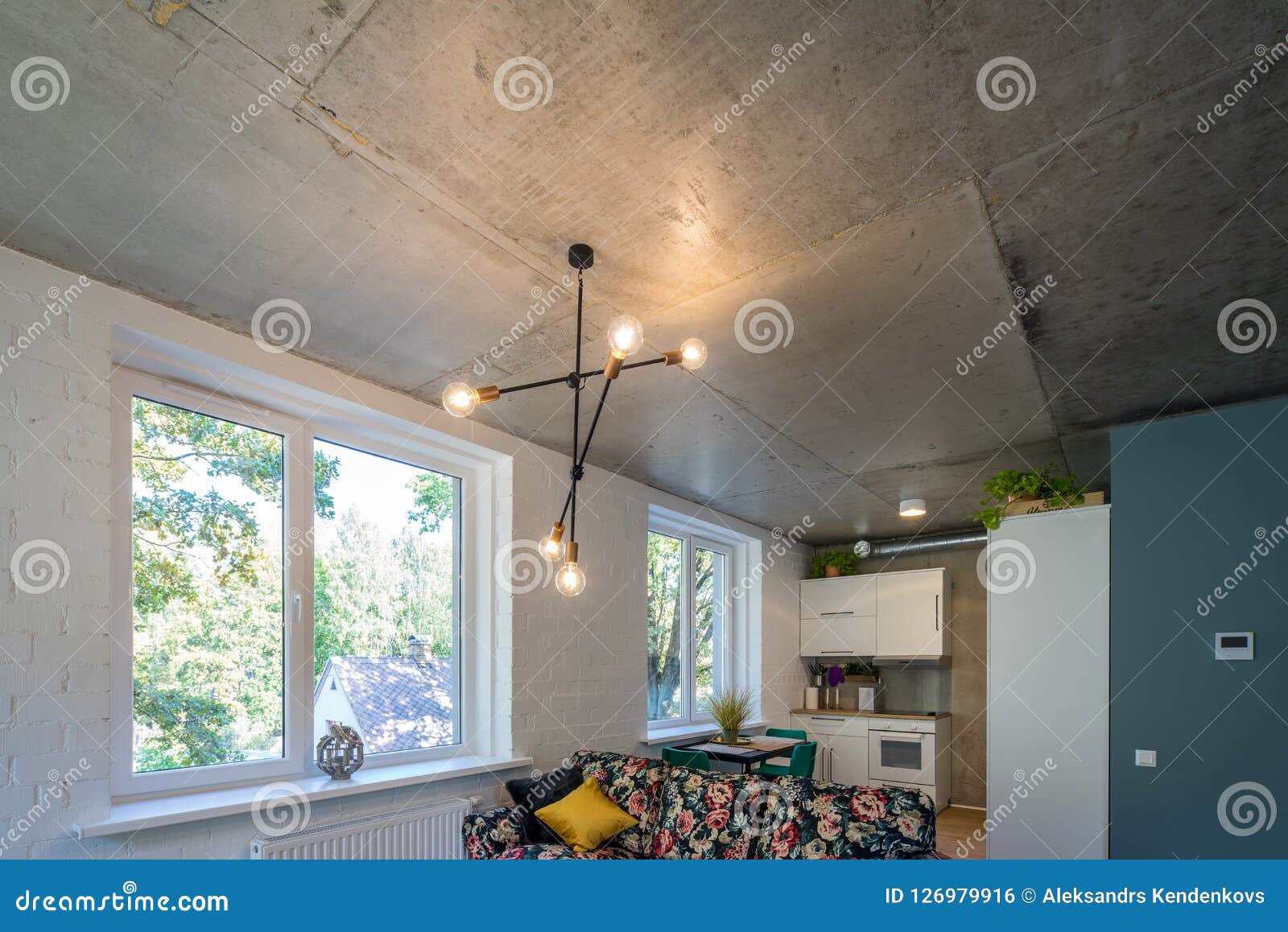 Concrete Ceiling and Lighting in a Modern Apartment. Concrete Style in