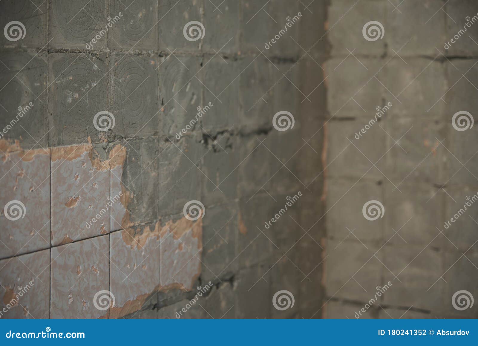 Concrete Wall in an Apartment with an Old Beaten Tile Stock Photo