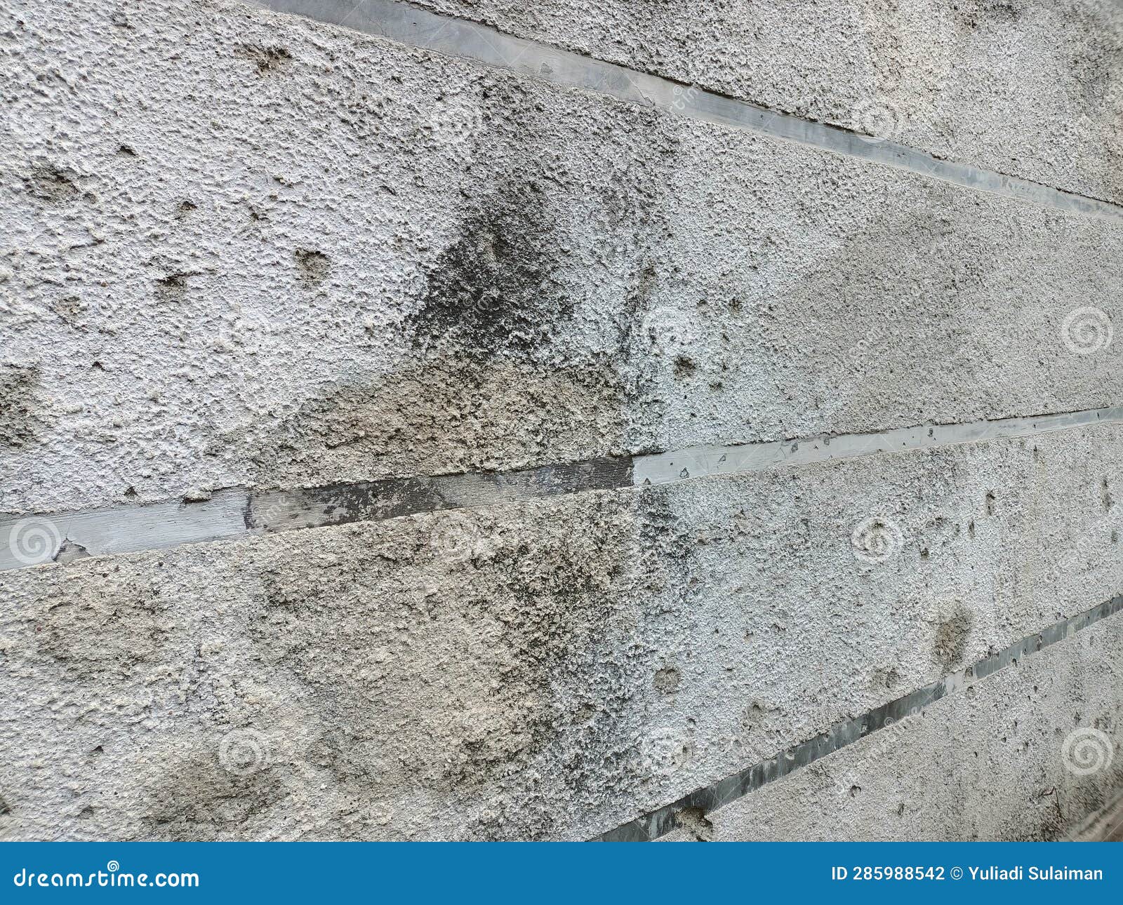 Concrete Walls Whose Cement Has Been Damaged by the Rain and Hot Sun