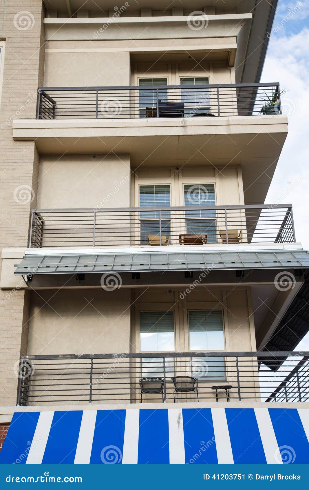 Condo Balconies Over Blue and White Awning Stock Image Image of
