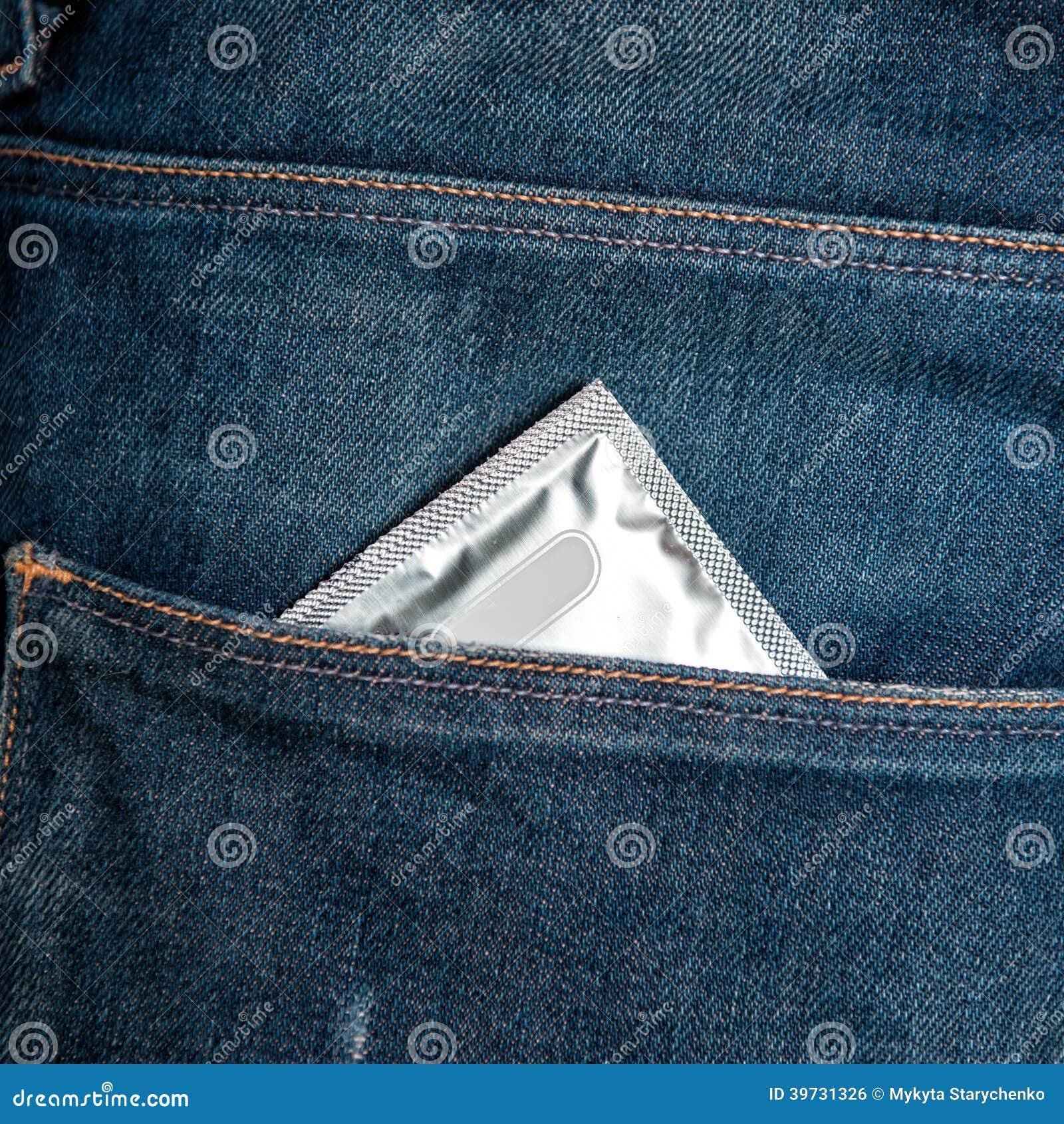 Condom in jeans pocket stock photo. Image of passion 39731326
