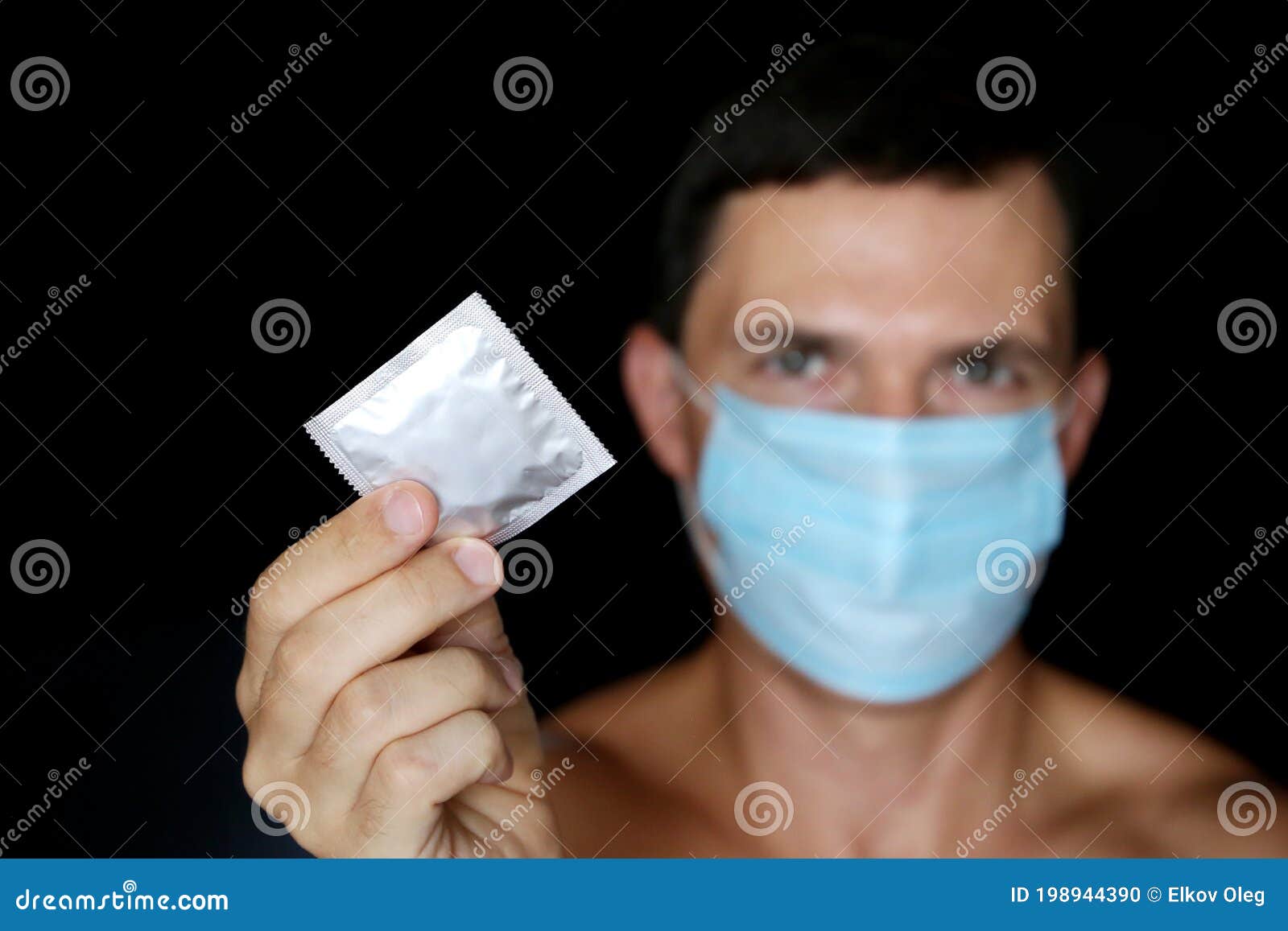 Condom in Male Hands Close Up, Safe Sex during Coronavirus Pandemic