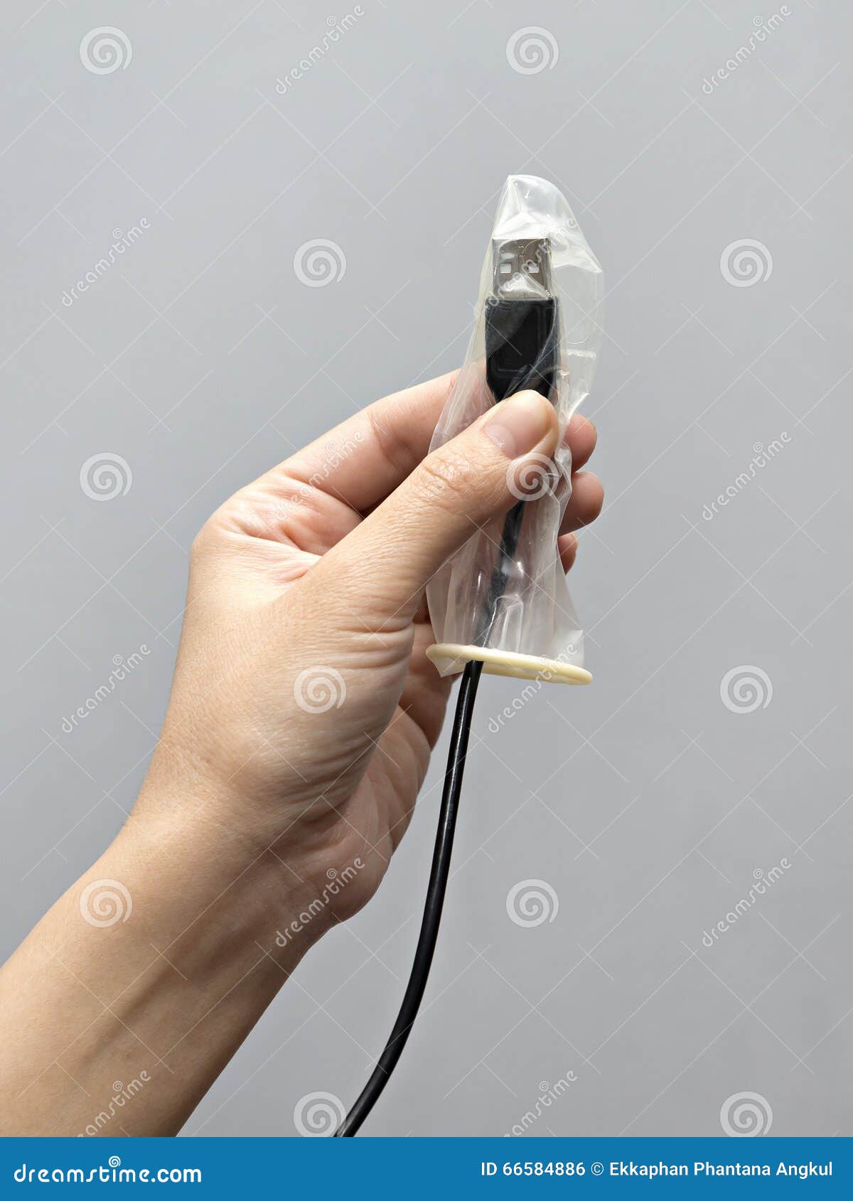 Condom on USB cable stock photo. Image of data, information 66584886