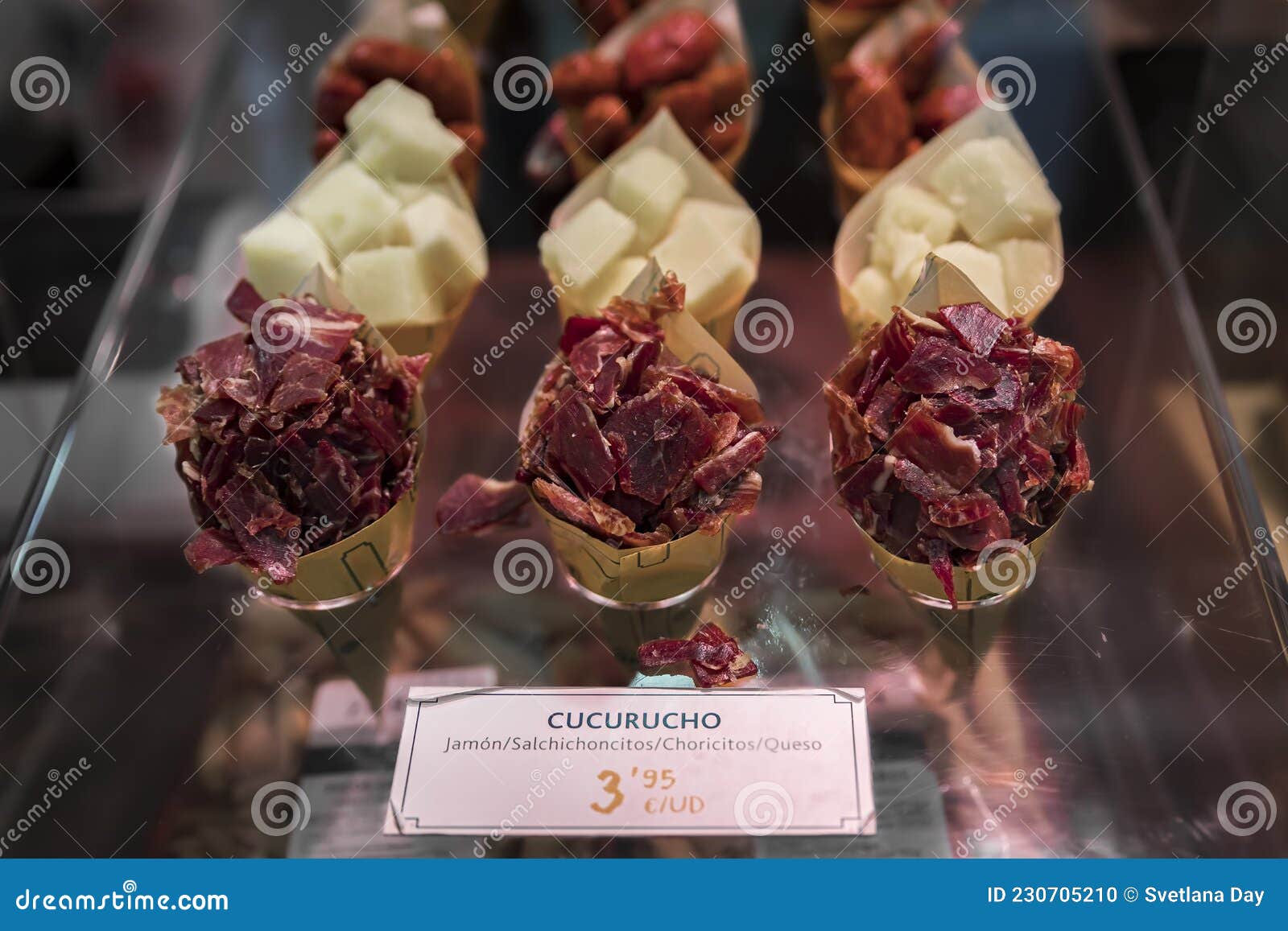 cones or cucurucho of iberico ham, sausage and cheese at butcher, pamplona spain