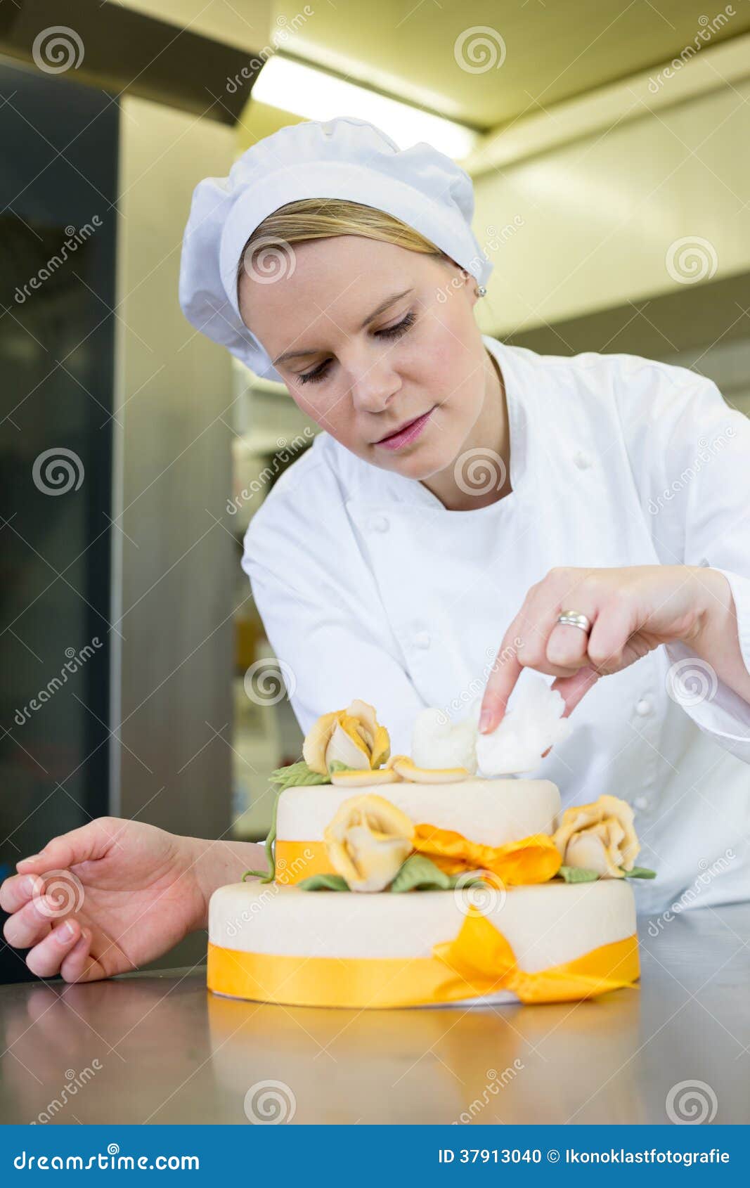 Confectioner, Baker or Pastry Cook Preparing Cake Stock Photo Image