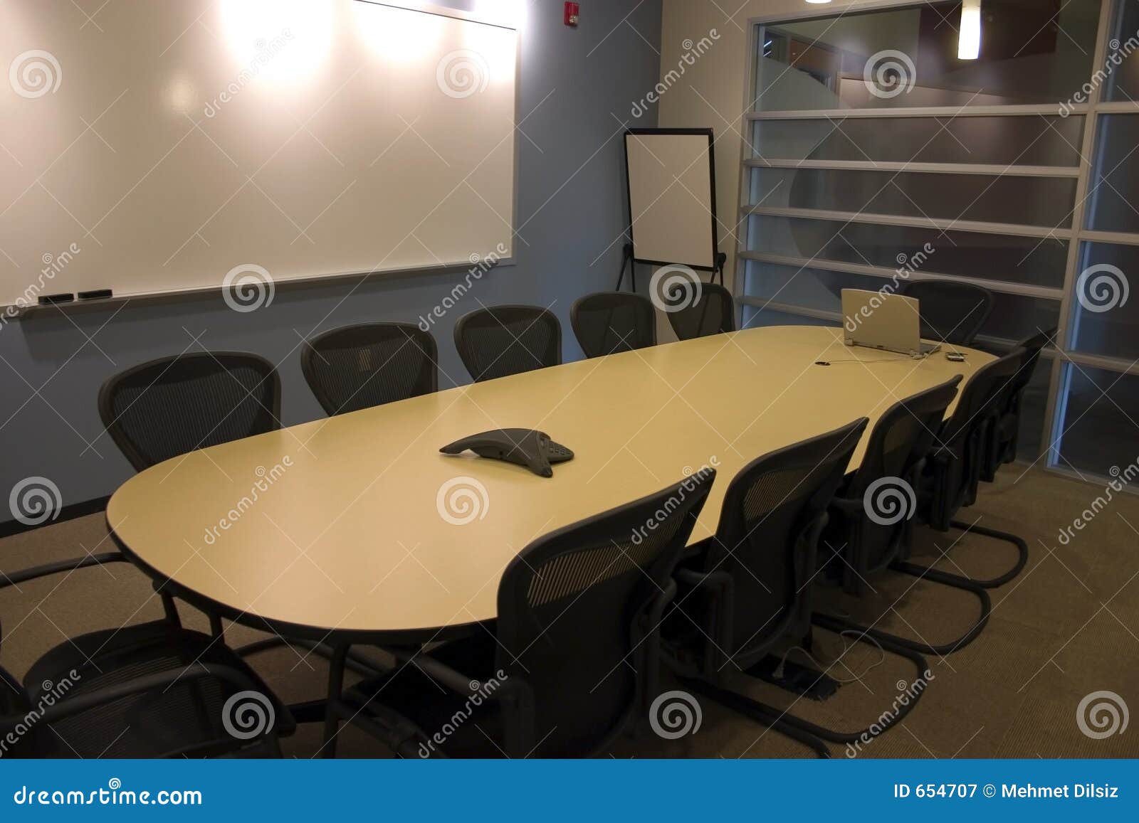 Conference Room with a Laptop and a PDA on the Table Stock Image