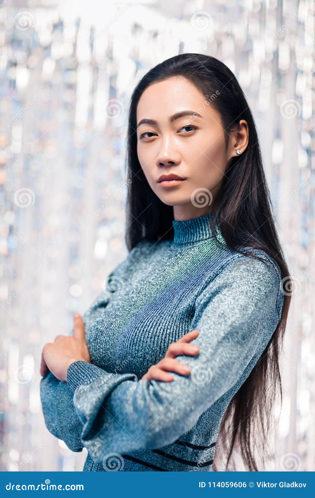 Confident Asian Woman in Blue Dress with Crossed Arms Stock Photo ...