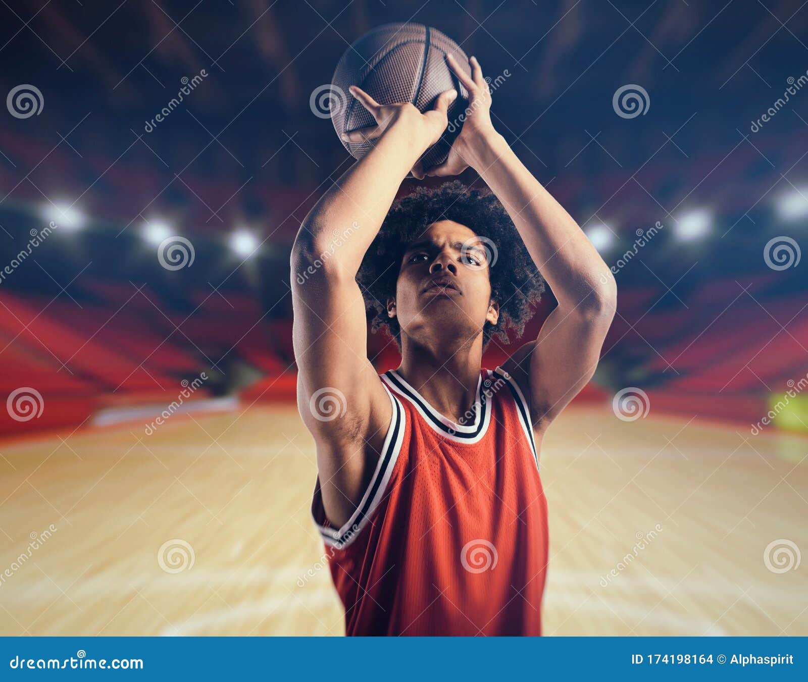 Young African American Boy With Basketball Taking A Free Throw Stock