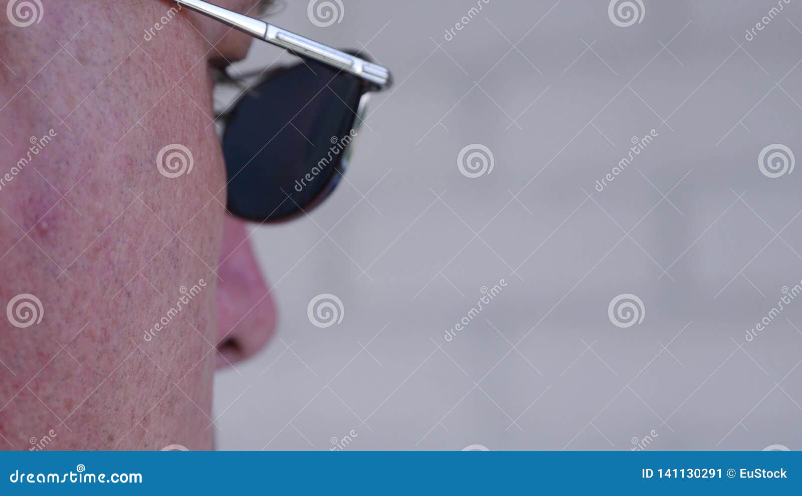 Confident Bodyguard Image Wearing Black Sunglasses Doing a Security Job