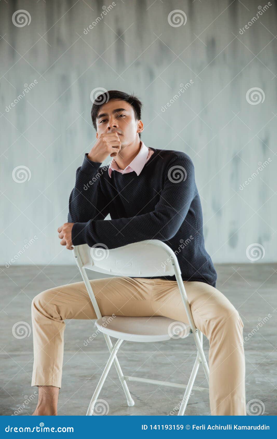 Confident Businessman Pose Sitting on White Chair Look at Camera Stock ...