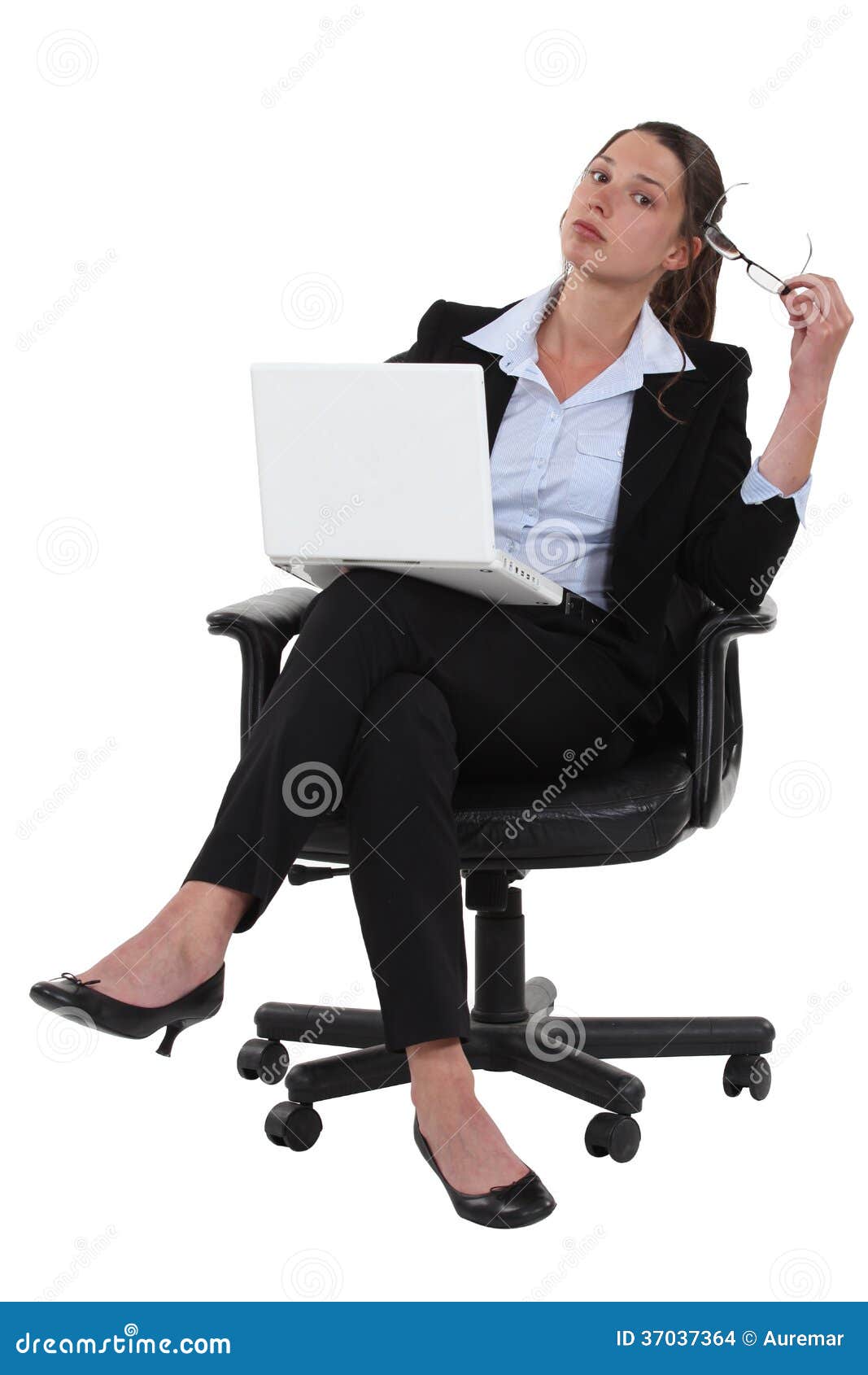 Confident Businesswoman Sitting Crosslegged Stock Photo