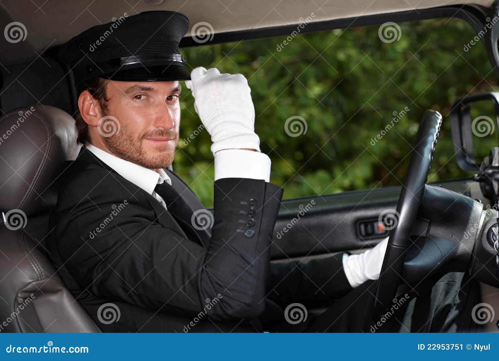 confident chauffeur in elegant automobile