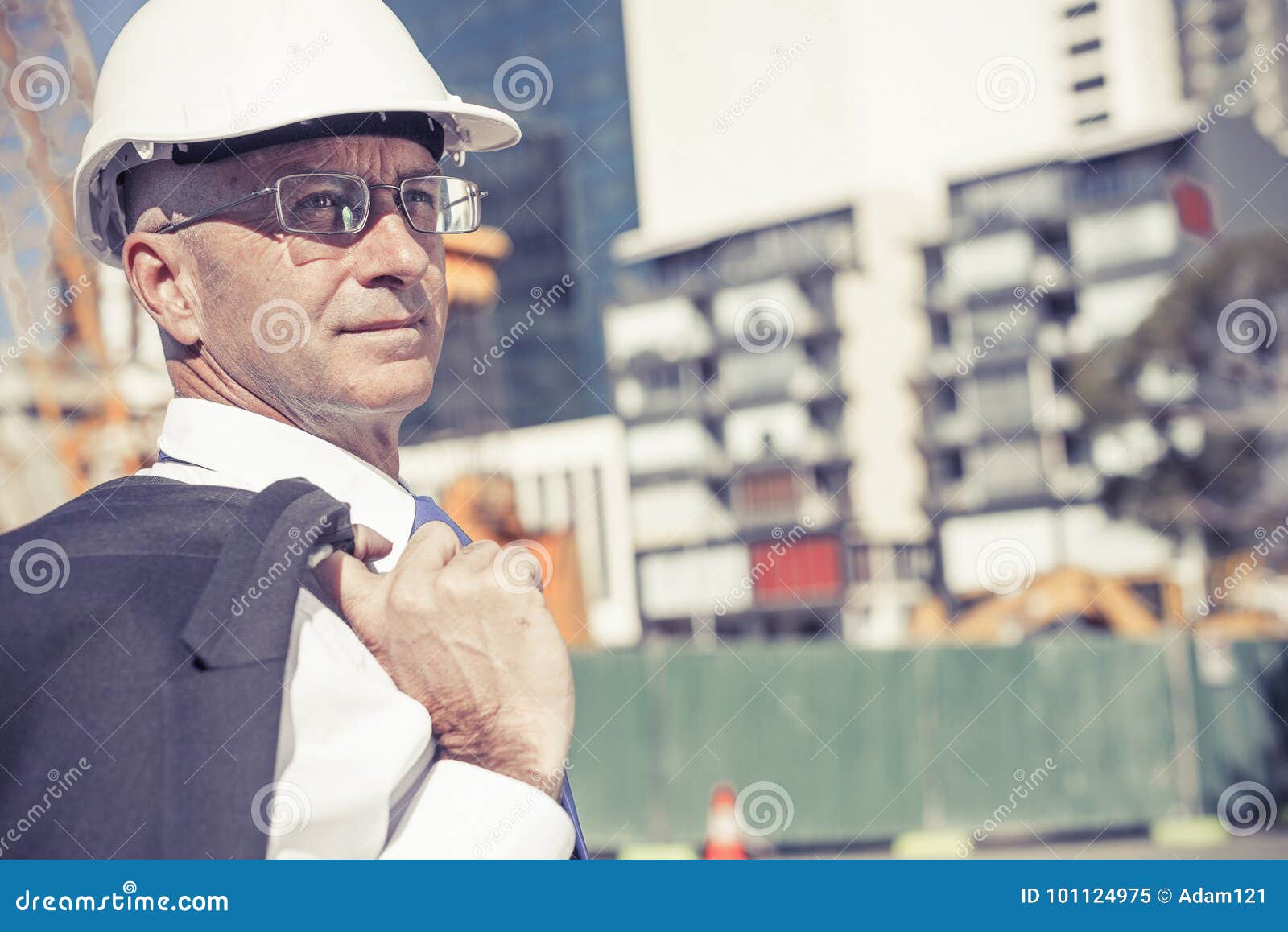 Senior Elegant Builder Man in Suit at Construction Site on Sunny Stock