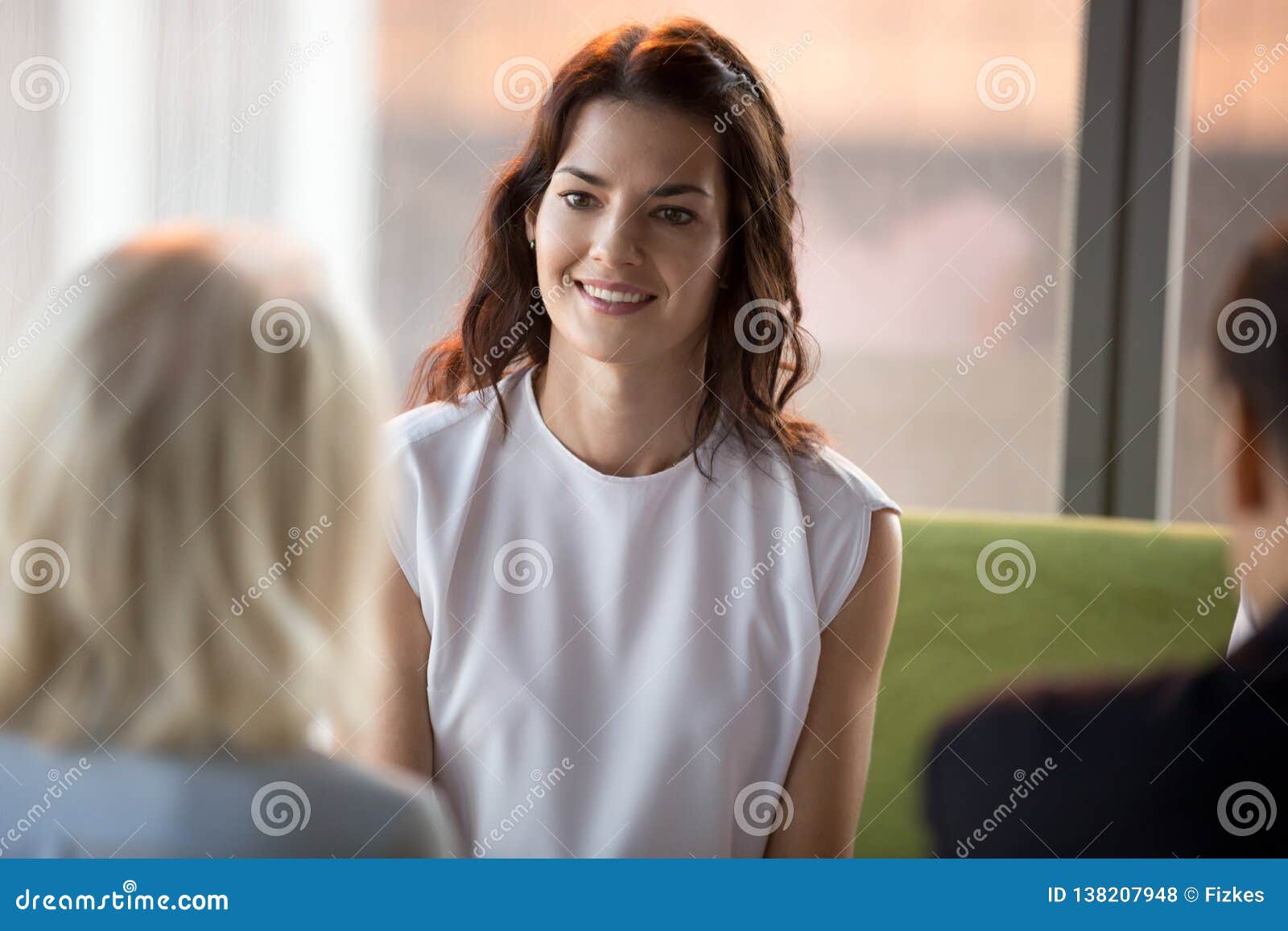 confident happy applicant smiling looking at hr during job interview