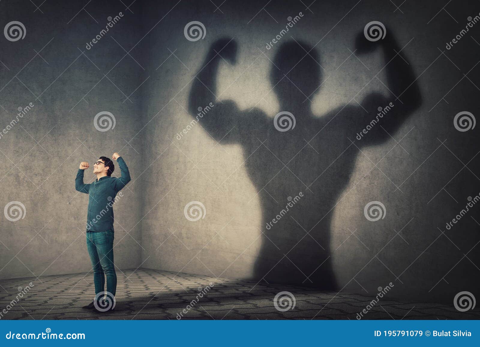 confident man flexing muscles imagine super power as casting a shadow of muscular bodybuilder showing biceps. strong person facing