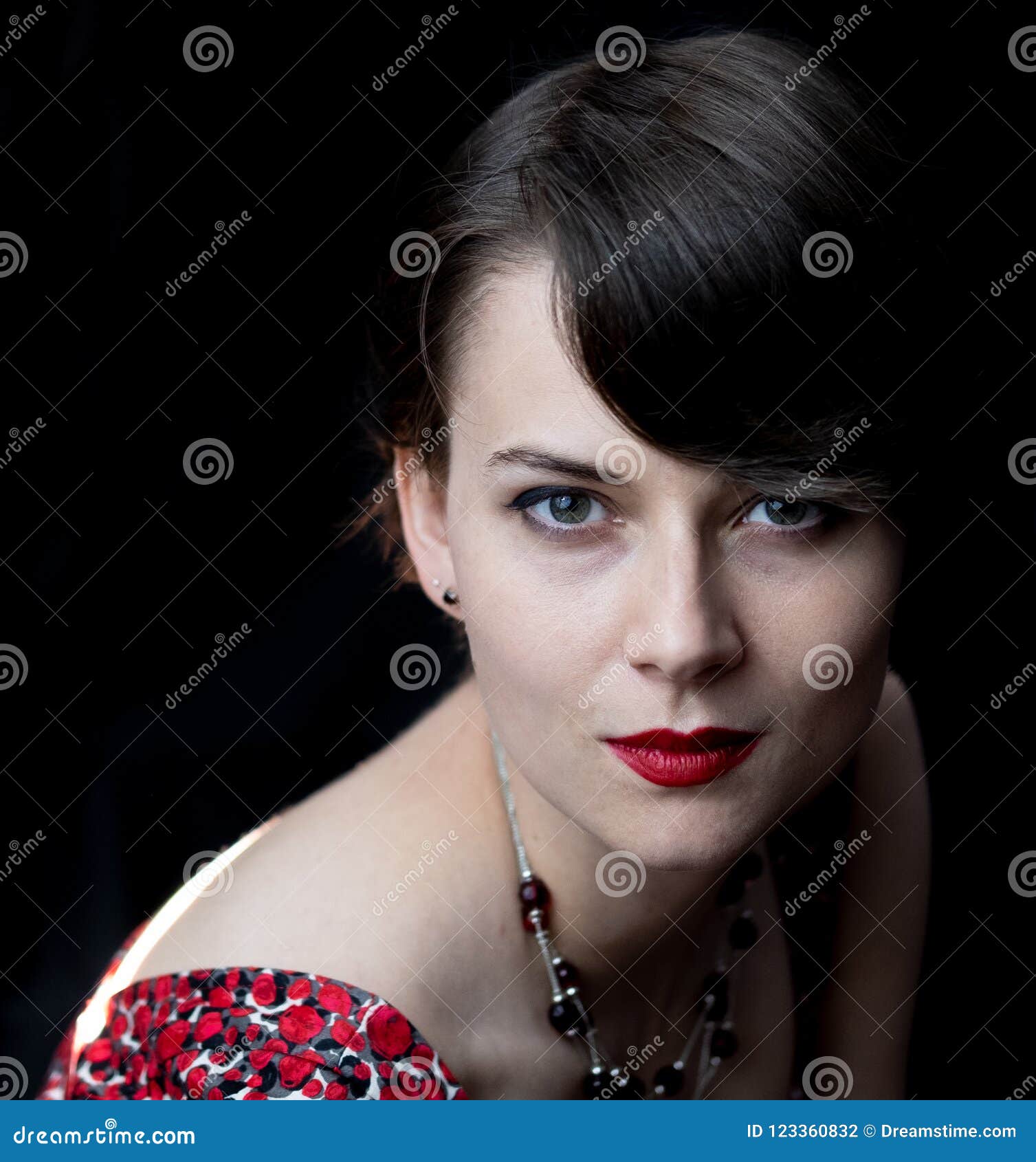 confident portrait of a young woman in red