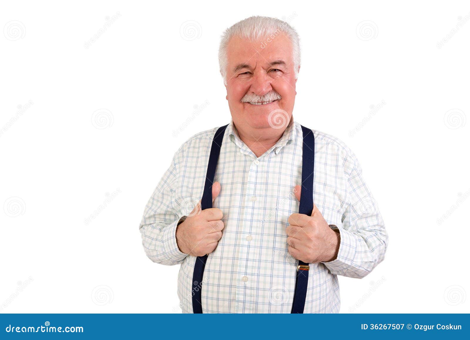 confident senior man holding his suspenders