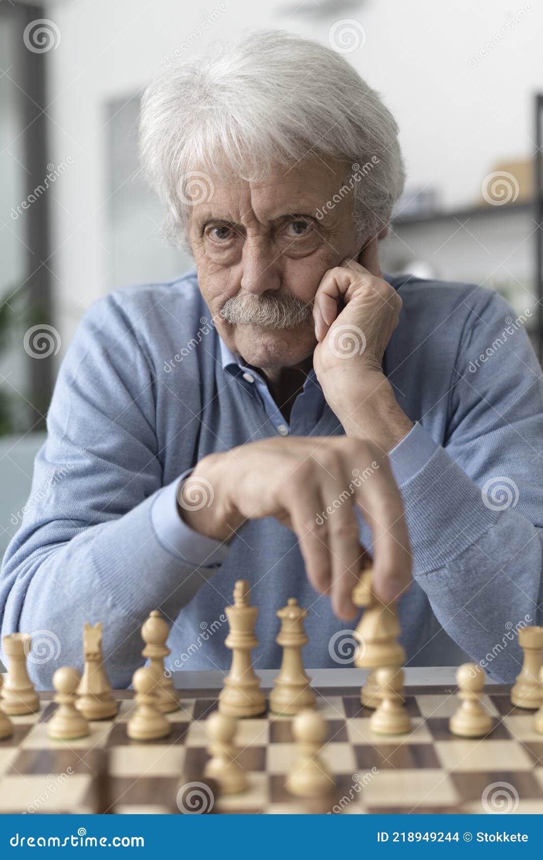 Premium Photo  Young bearded man in sunglasses sitting on a wooden park  bench planning his next chess move