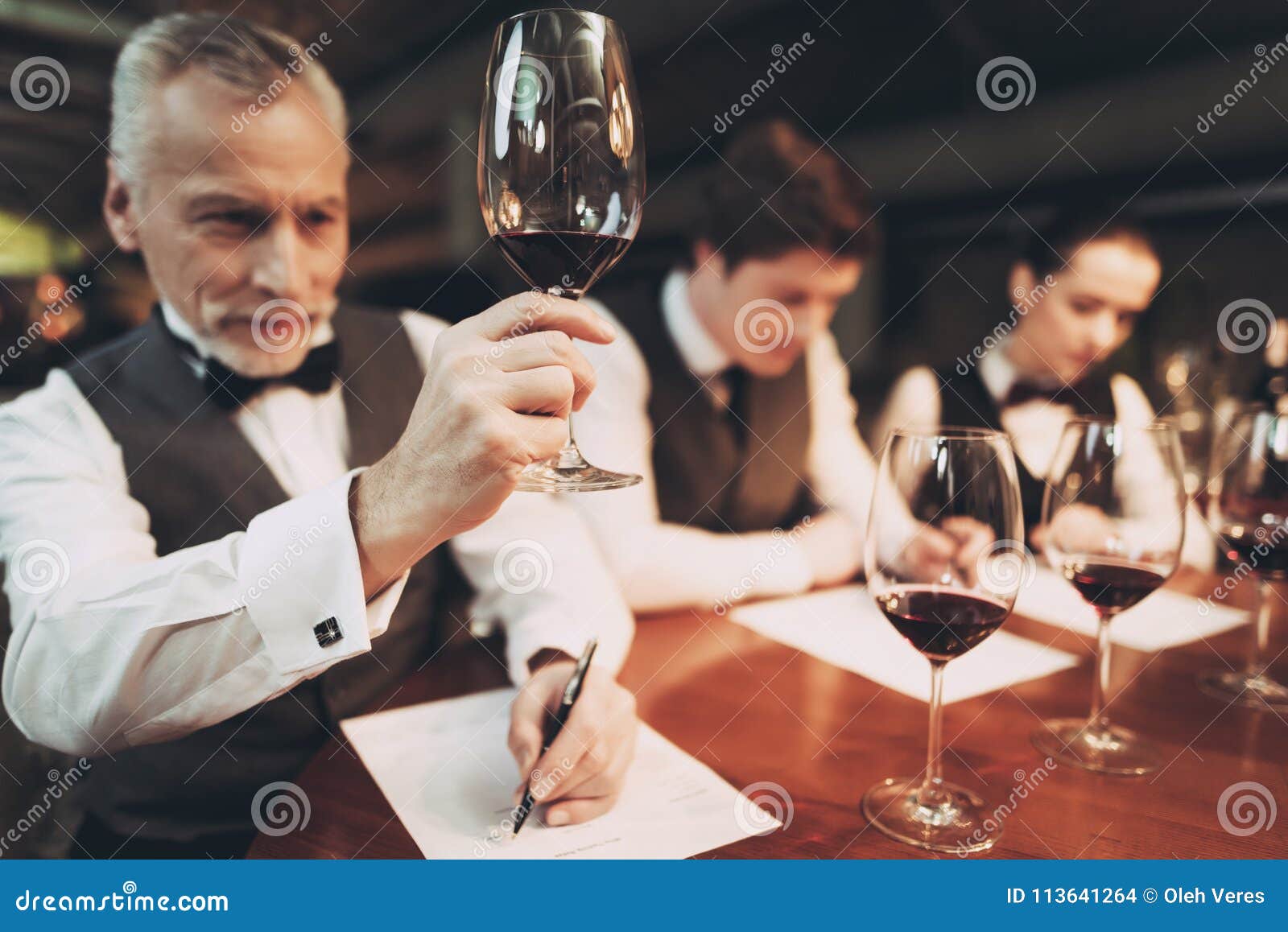 Confident Sommelier Tasting Wine in Restaurant. Tasting Specialist