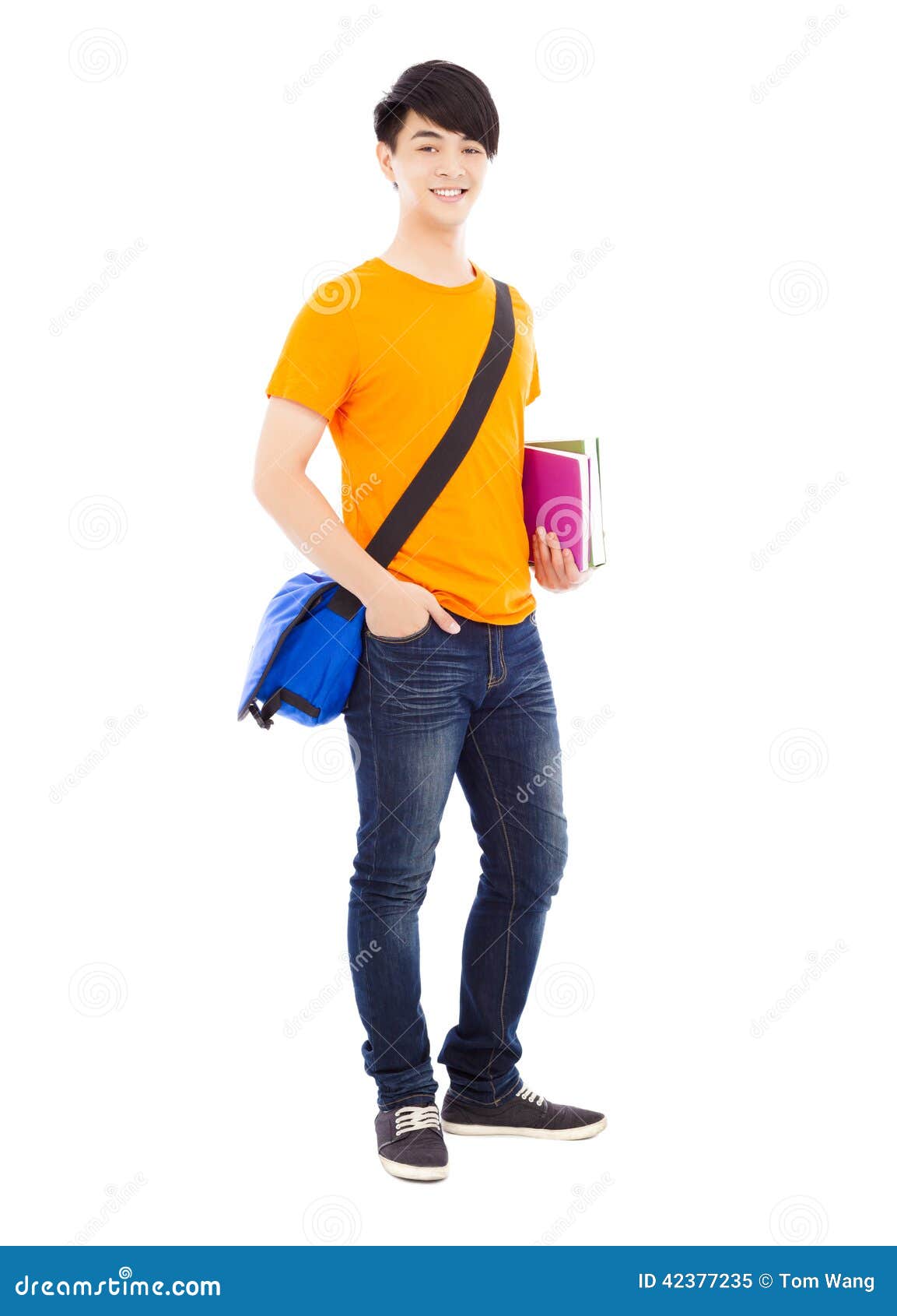 confident student holding books and slanting knapsack