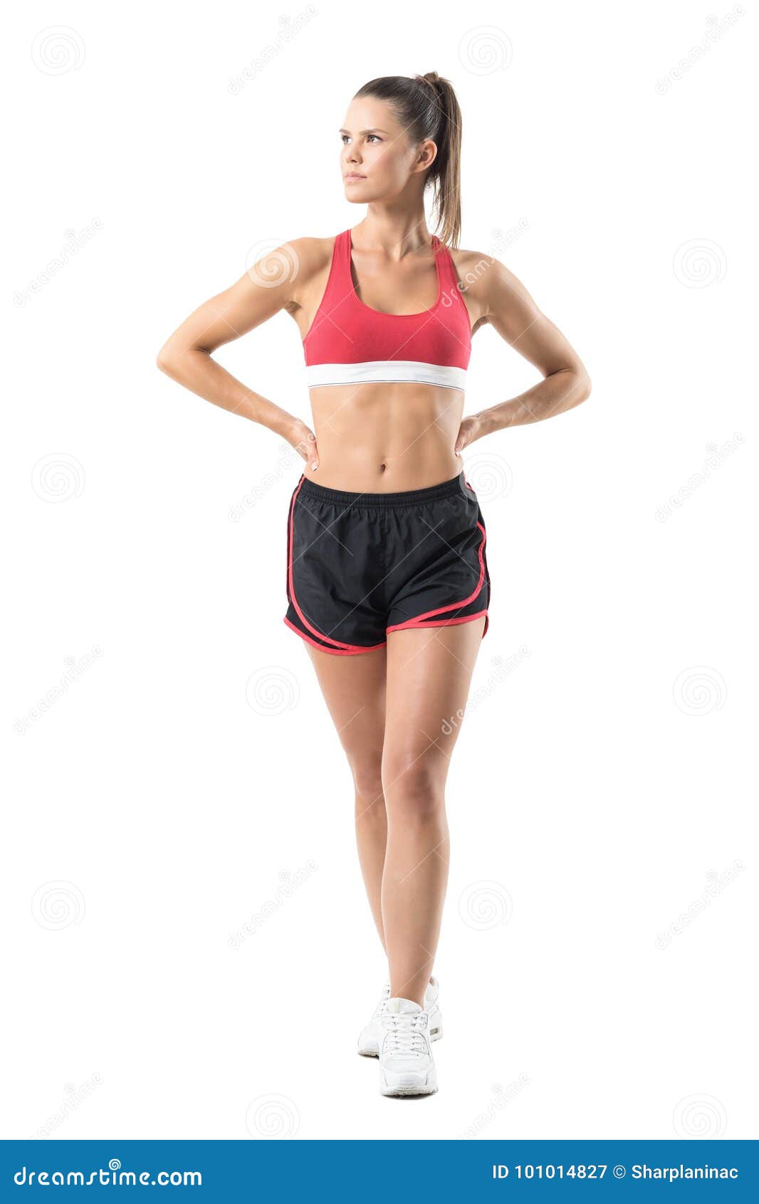 Standing Happy Woman In Sports Bra And Gym Shorts Posing For The Camera  Stock Photo, Picture and Royalty Free Image. Image 31994079.