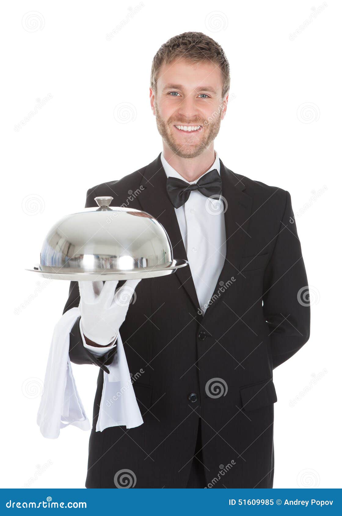 confident waiter holding domed tray