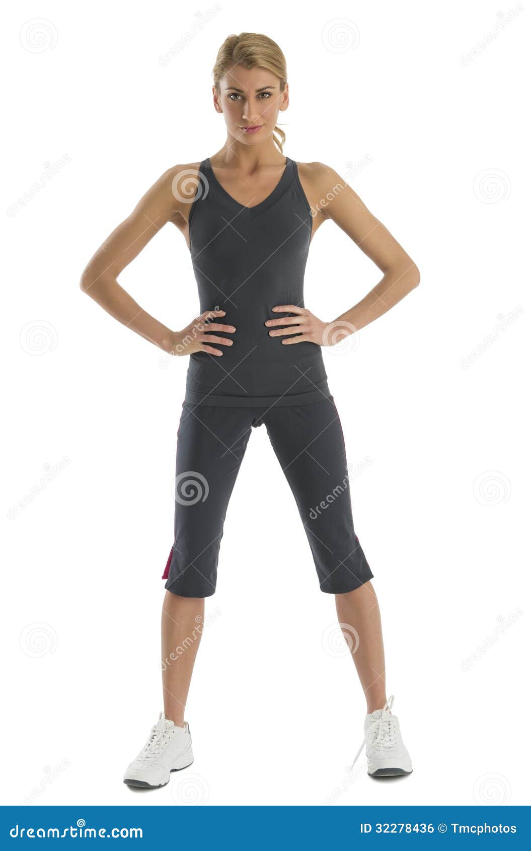 Confident Woman in Sports Clothing with Hands on Hips Stock Photo ...