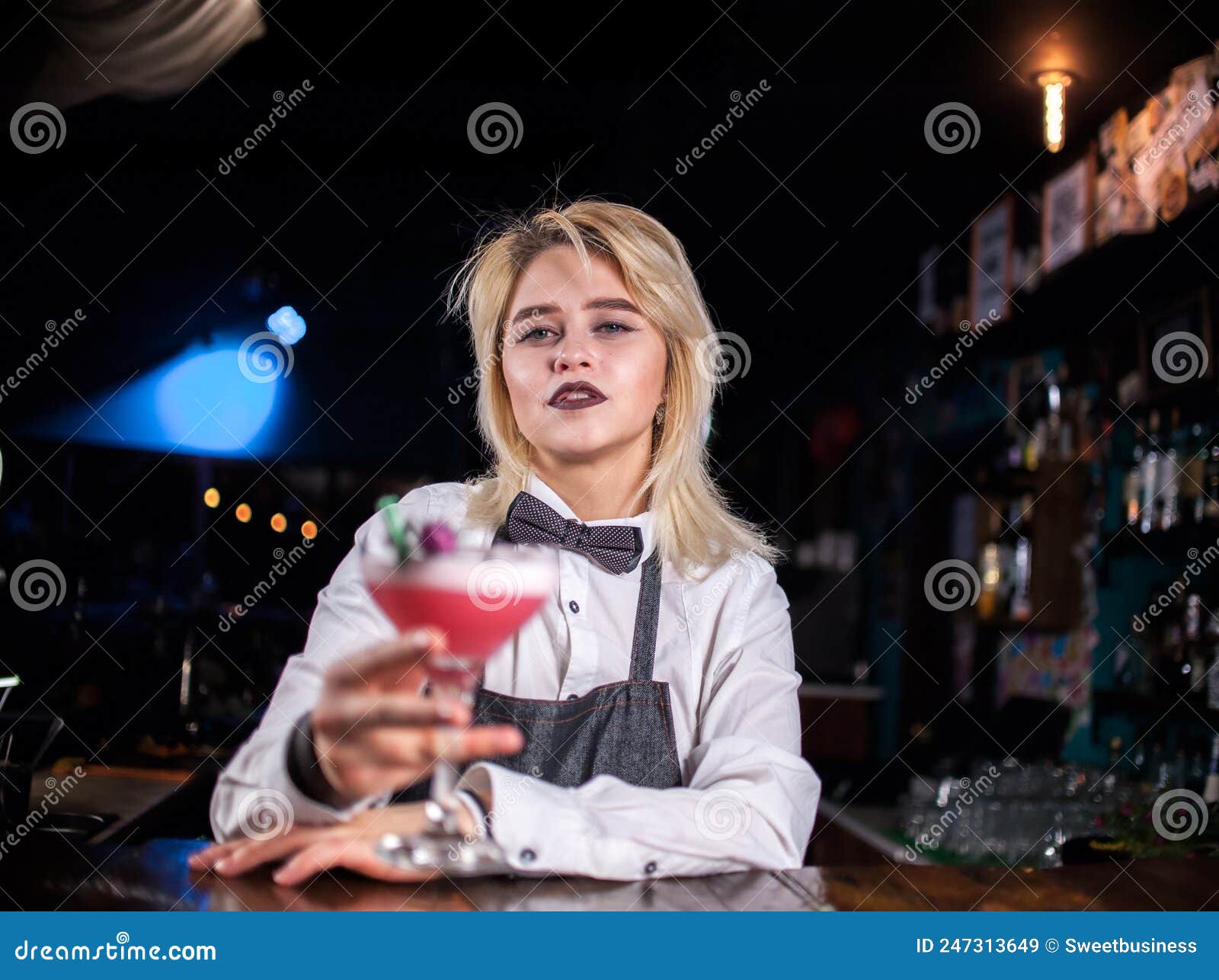 Young Girl Bartender Demonstrates the Process of Making a Cocktail ...