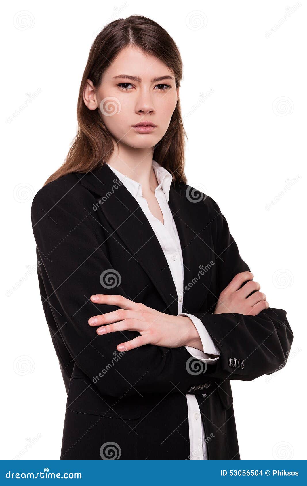 Confident young businesswoman / student arms crossed in Studio - Stock Image