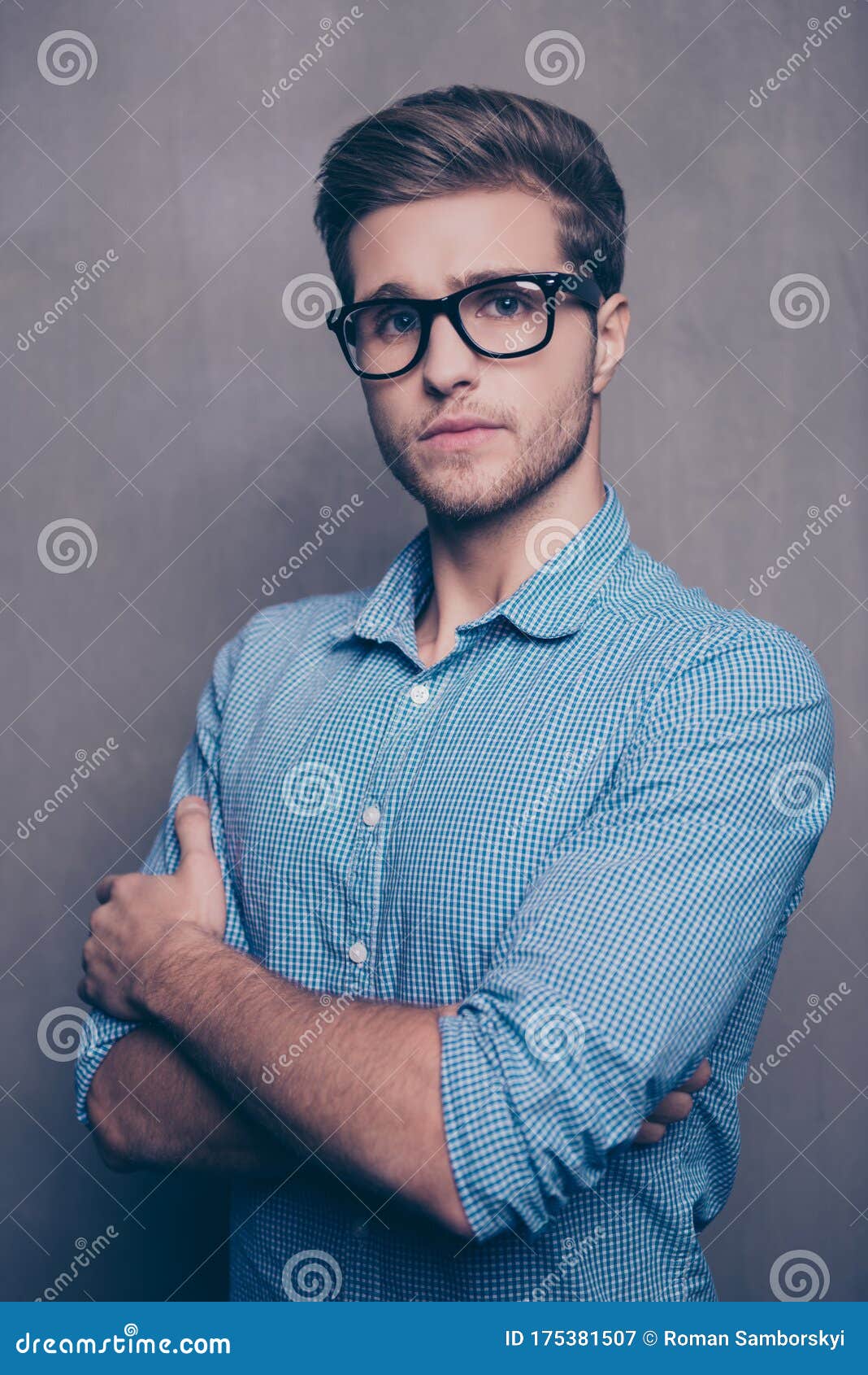 Confident Young Smart Man in Glasses with Crossed Hands Stock Image