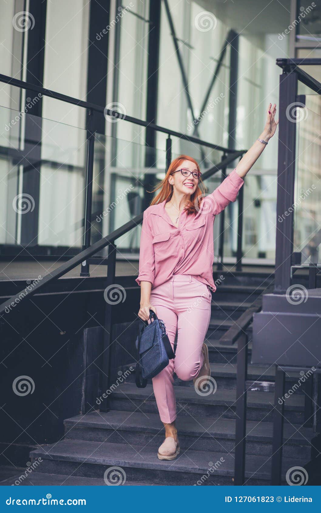 confident young woman hails a taxi