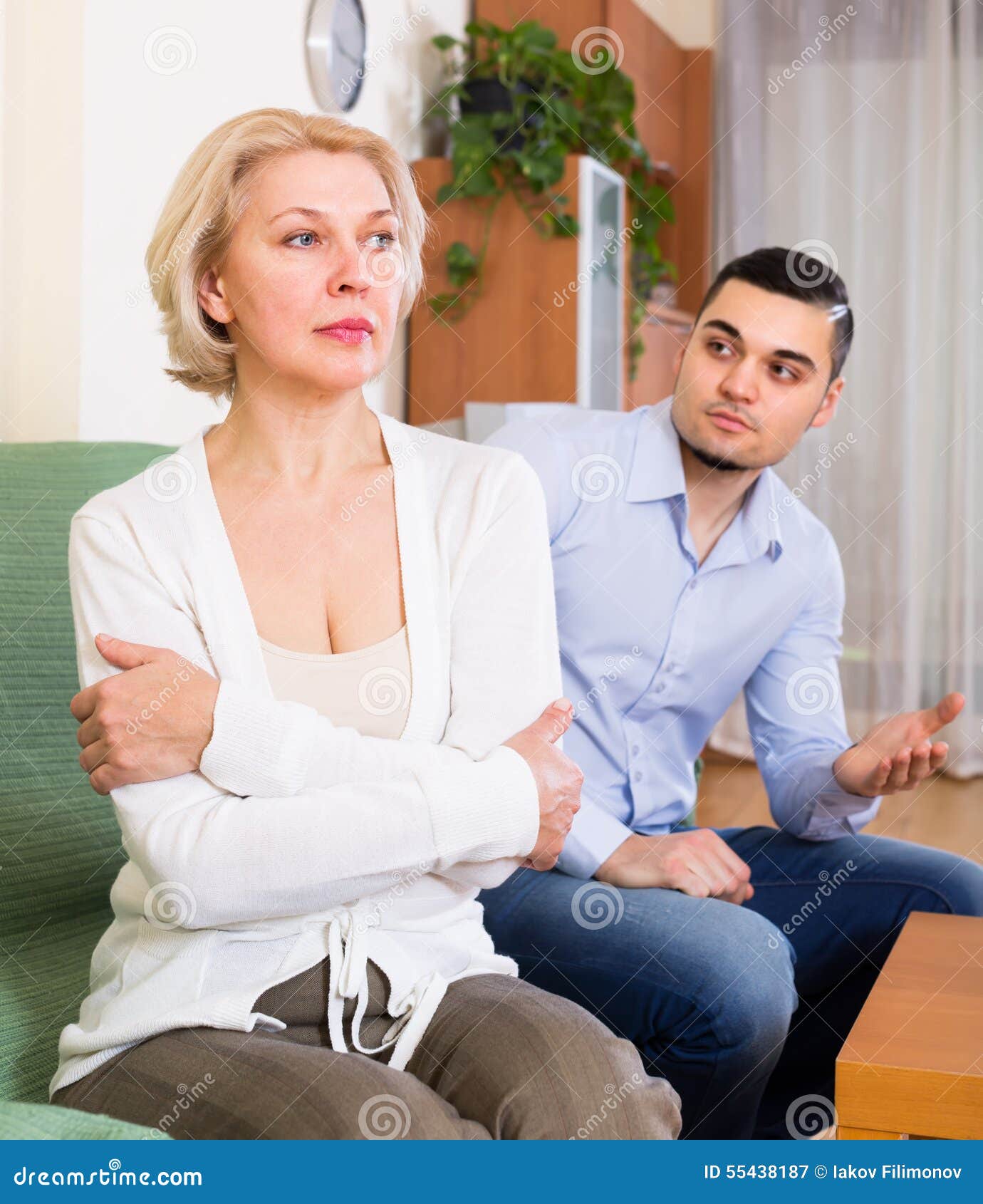 Conflict Of Aged Woman And Young Guy Stock Image I